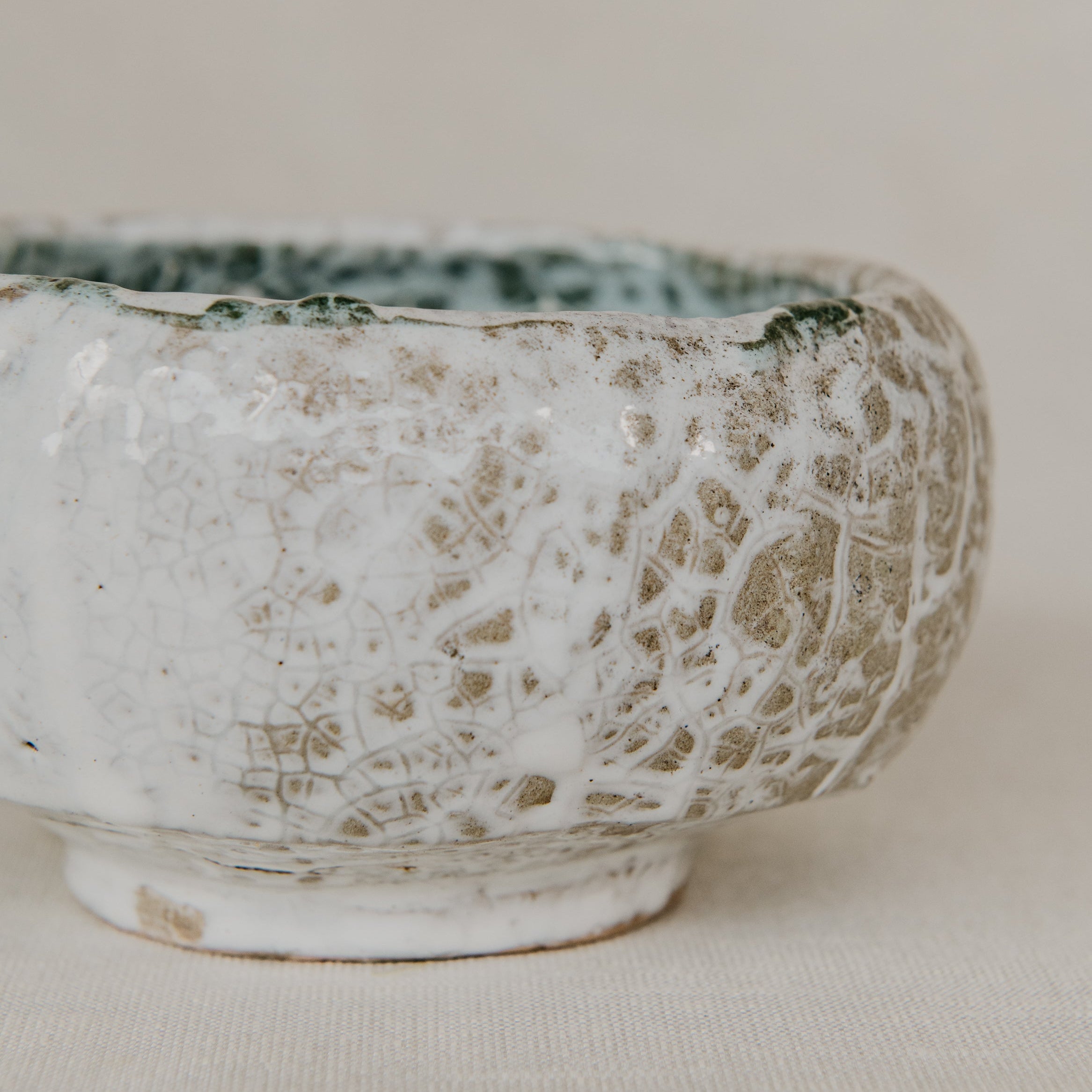 Ceramic bowl with textured surface on a light background