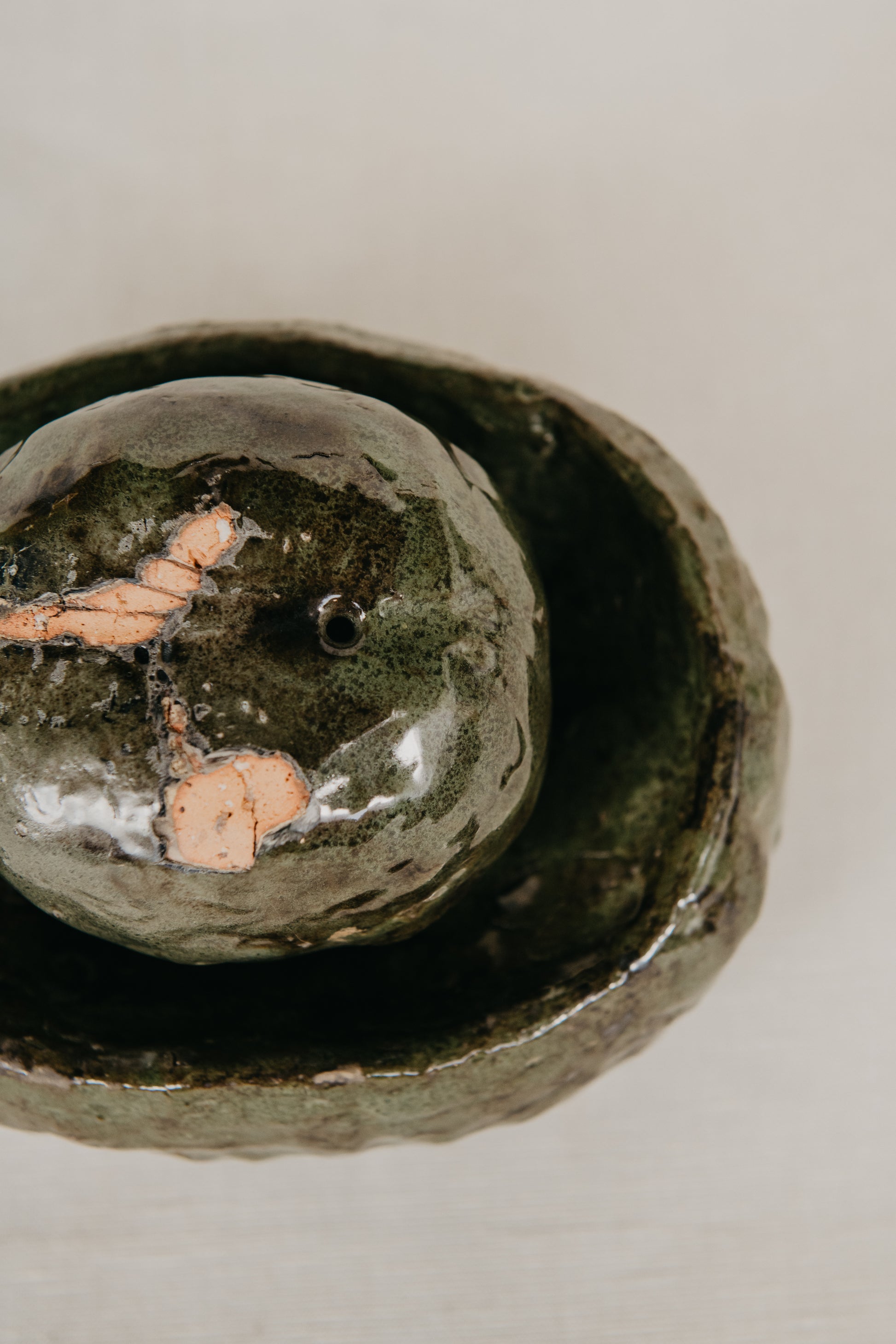 Two ceramic bowls with a textured surface on a light background