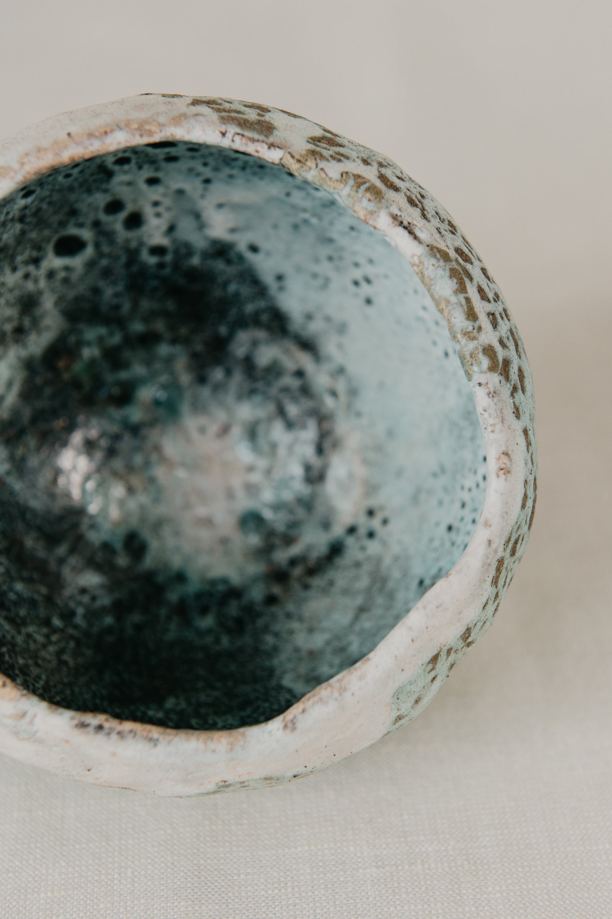 Ceramic bowl with textured surface on a light background