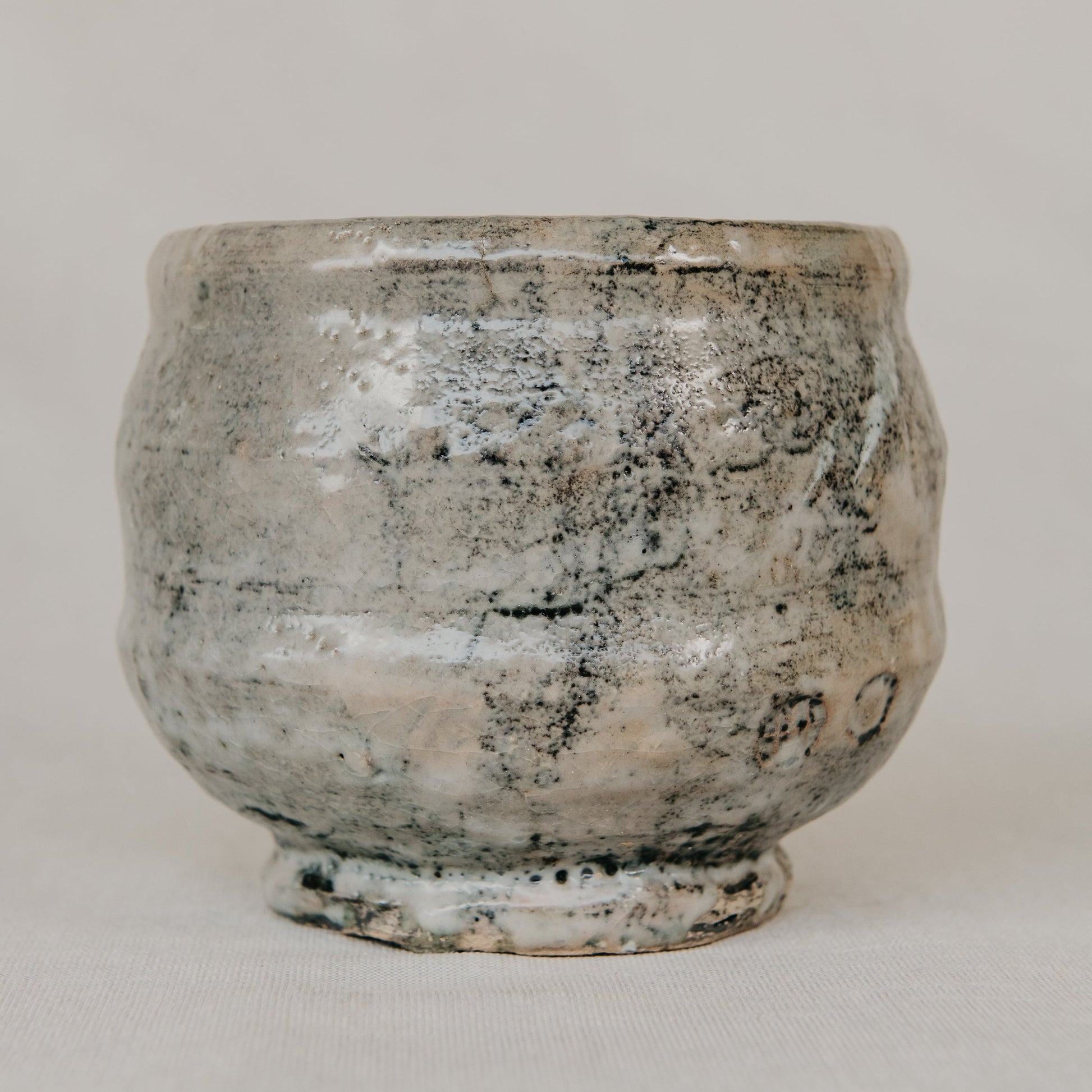 Vintage-style ceramic pot on a plain background