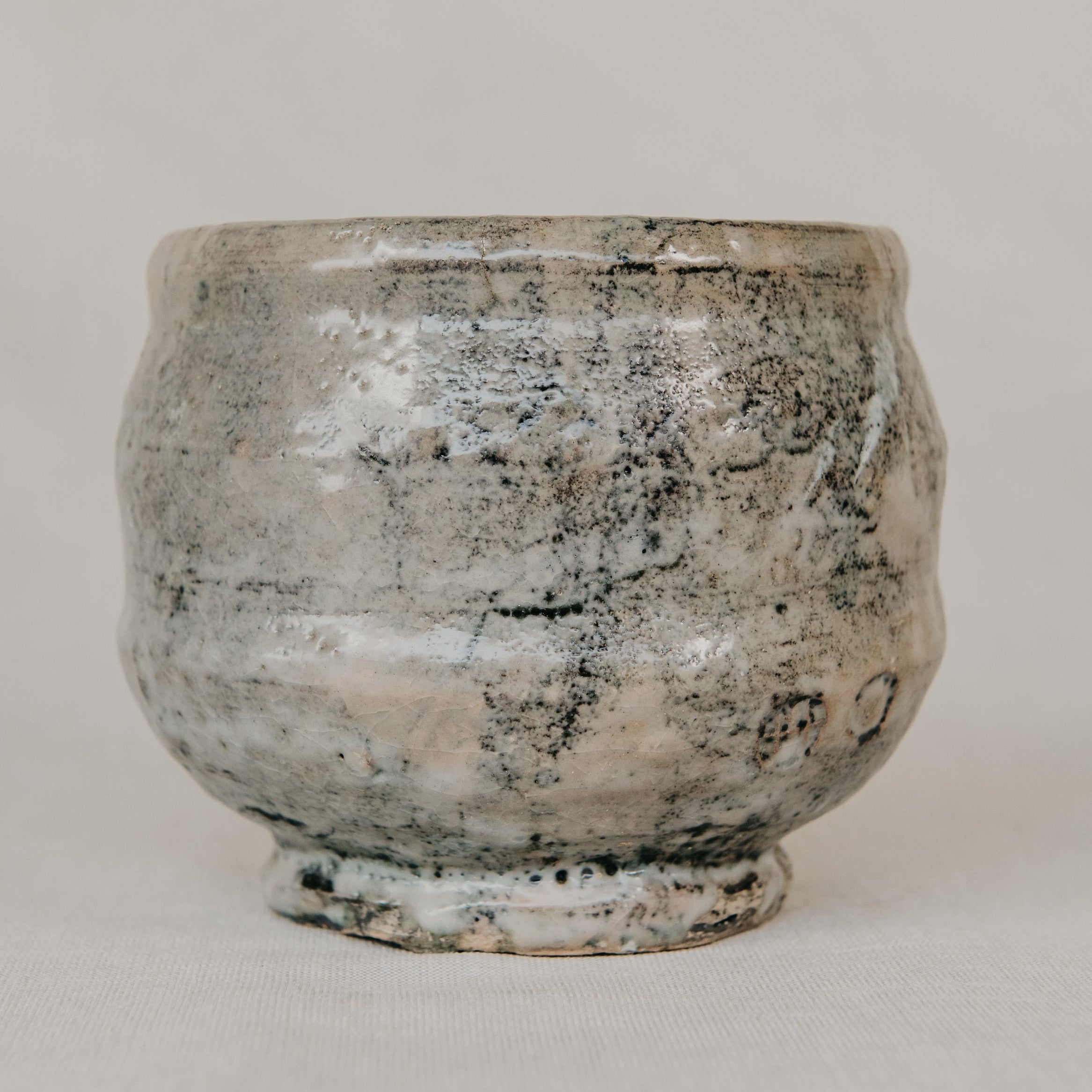 Vintage-style ceramic pot on a plain background