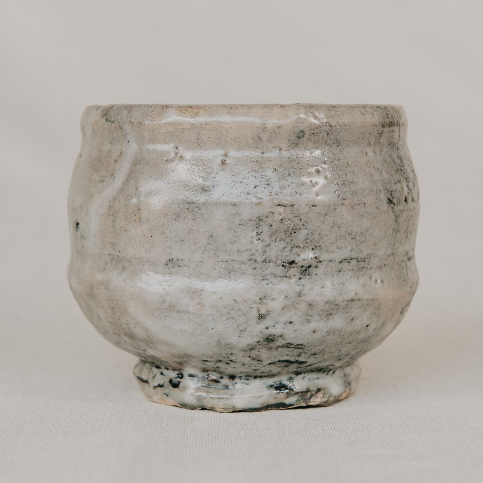 Vintage stone pot on a plain background