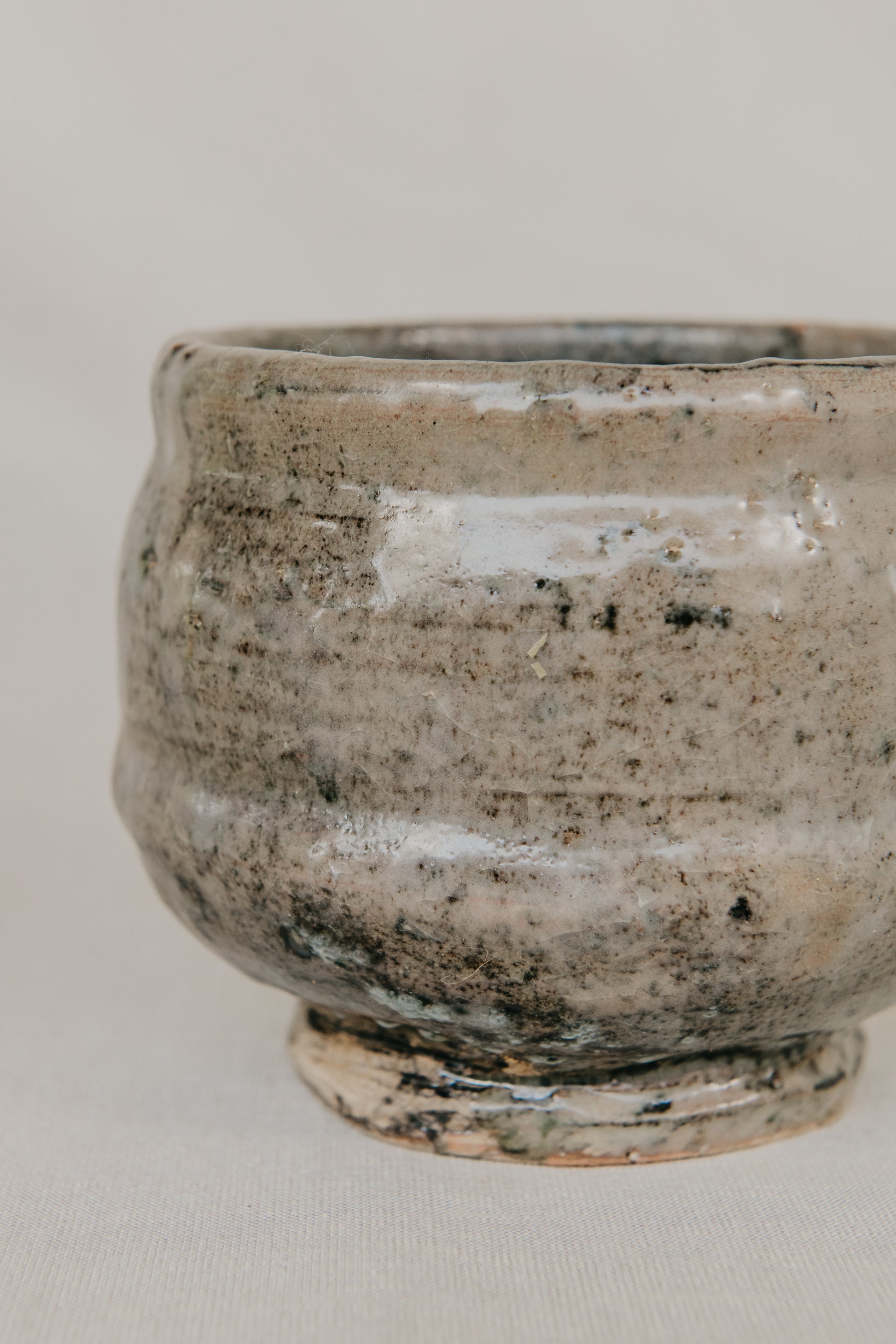 Ceramic bowl with textured surface on a plain background