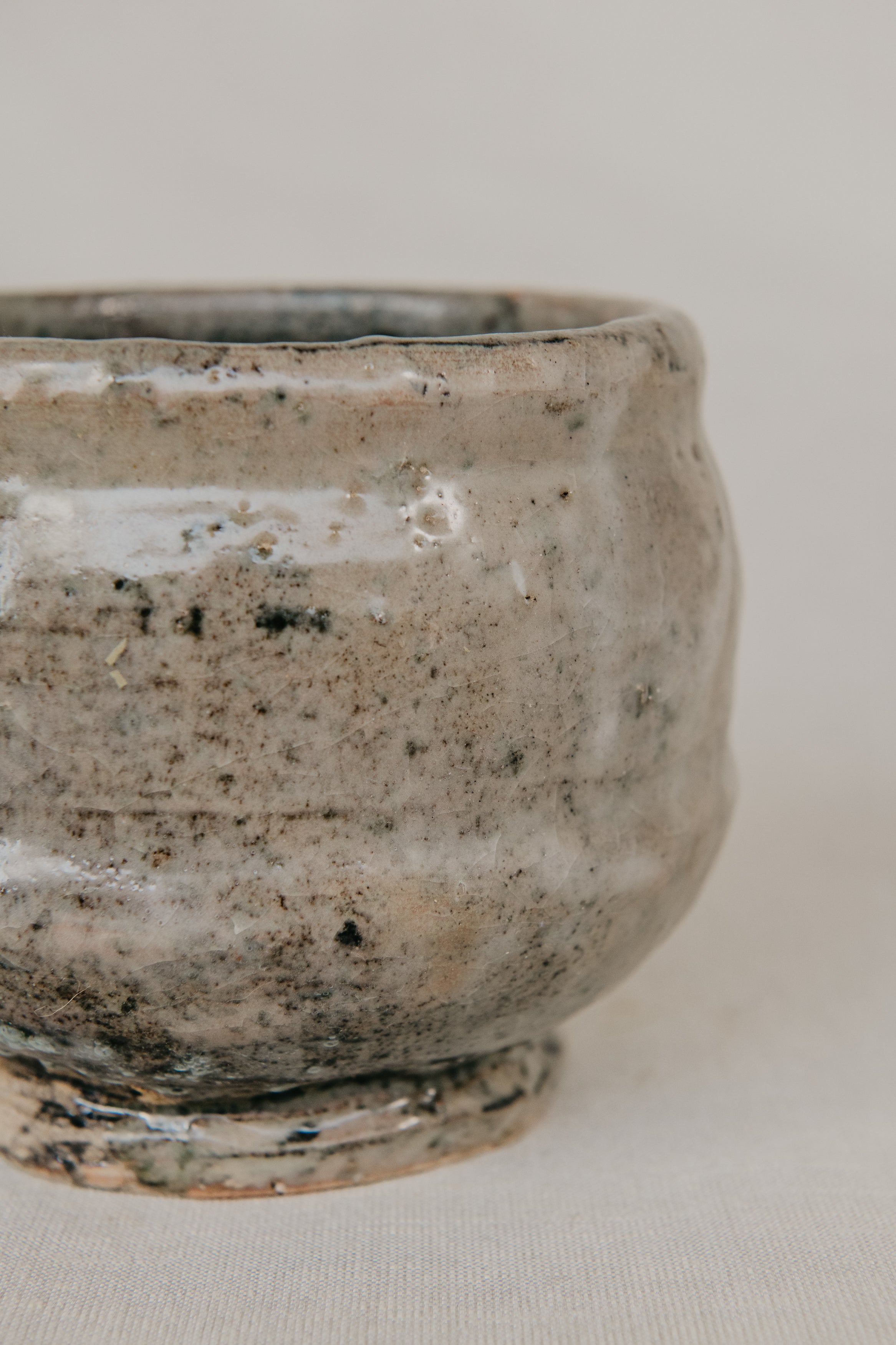 Ceramic bowl with textured surface on a plain background