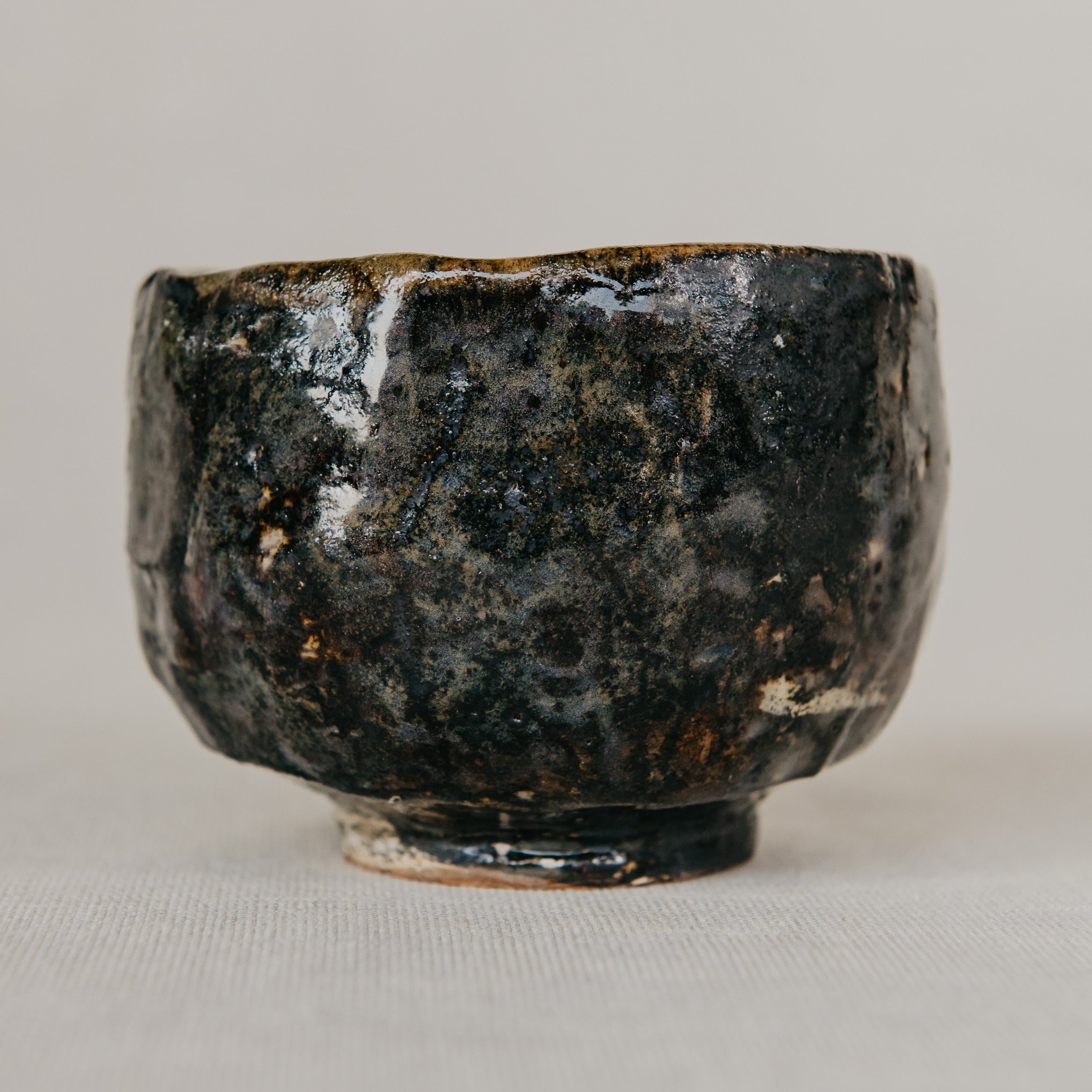 Black ceramic bowl on a light gray background