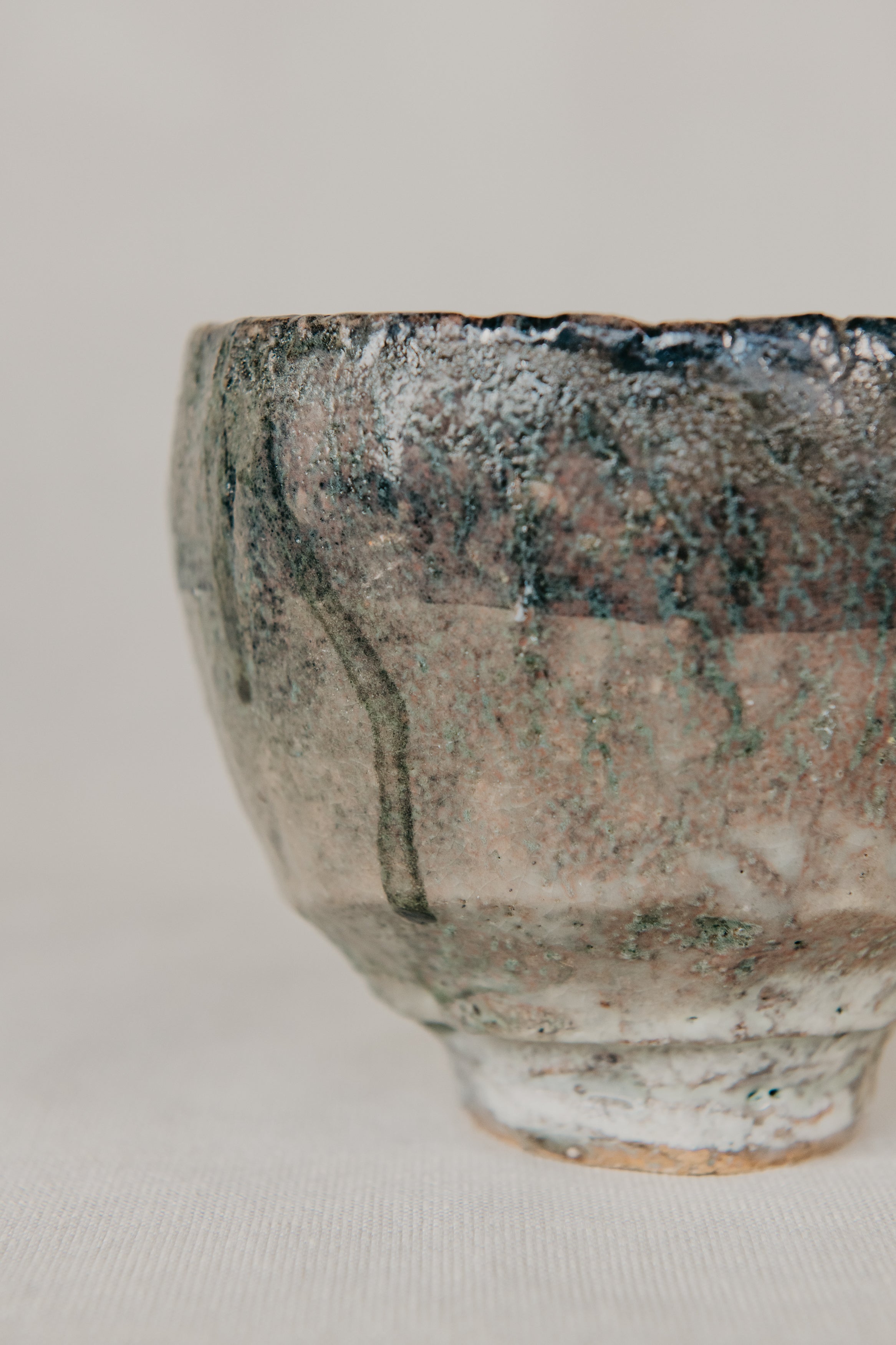 Ceramic bowl with textured surface on a plain background