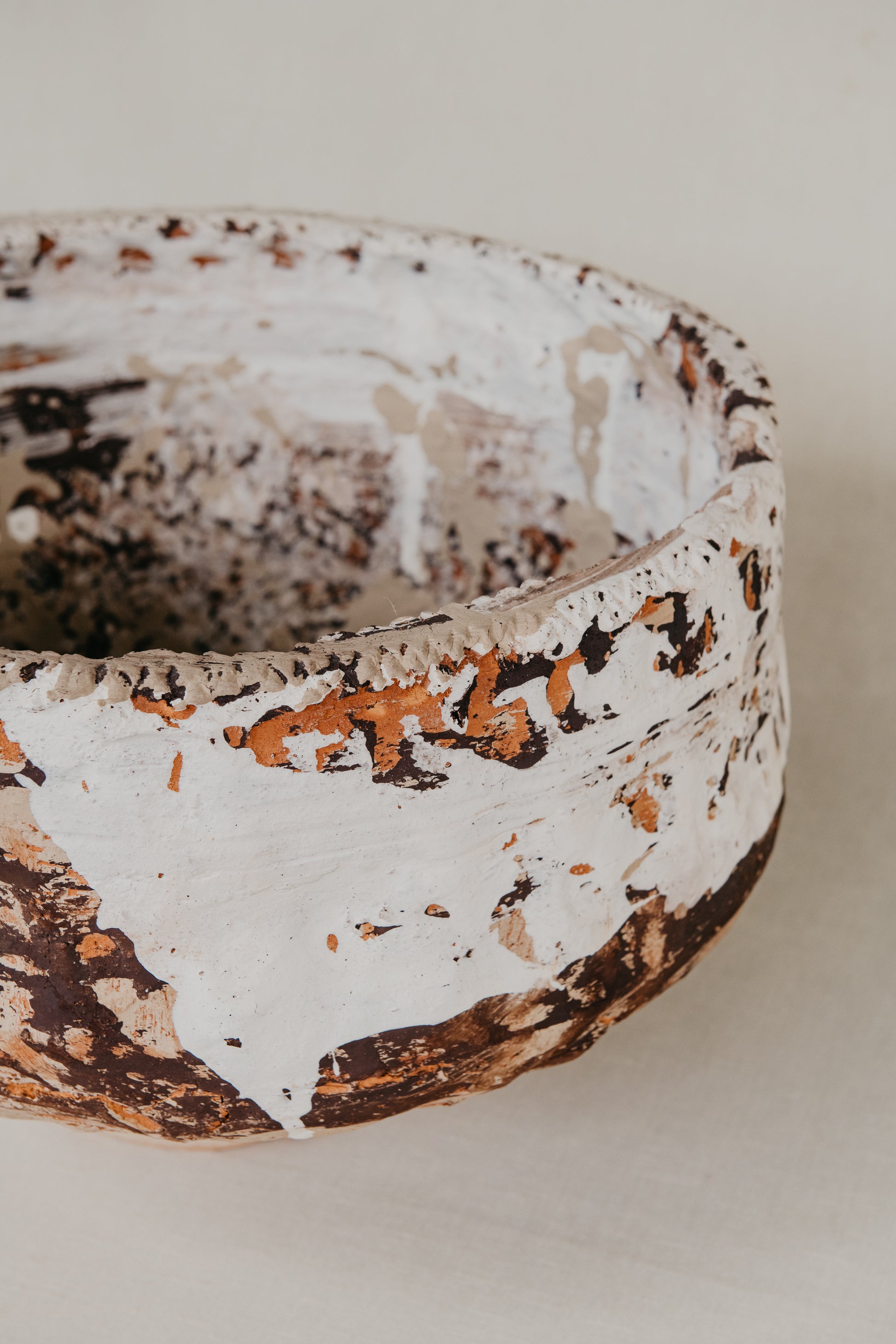 Ceramic bowl with a textured surface on a plain background