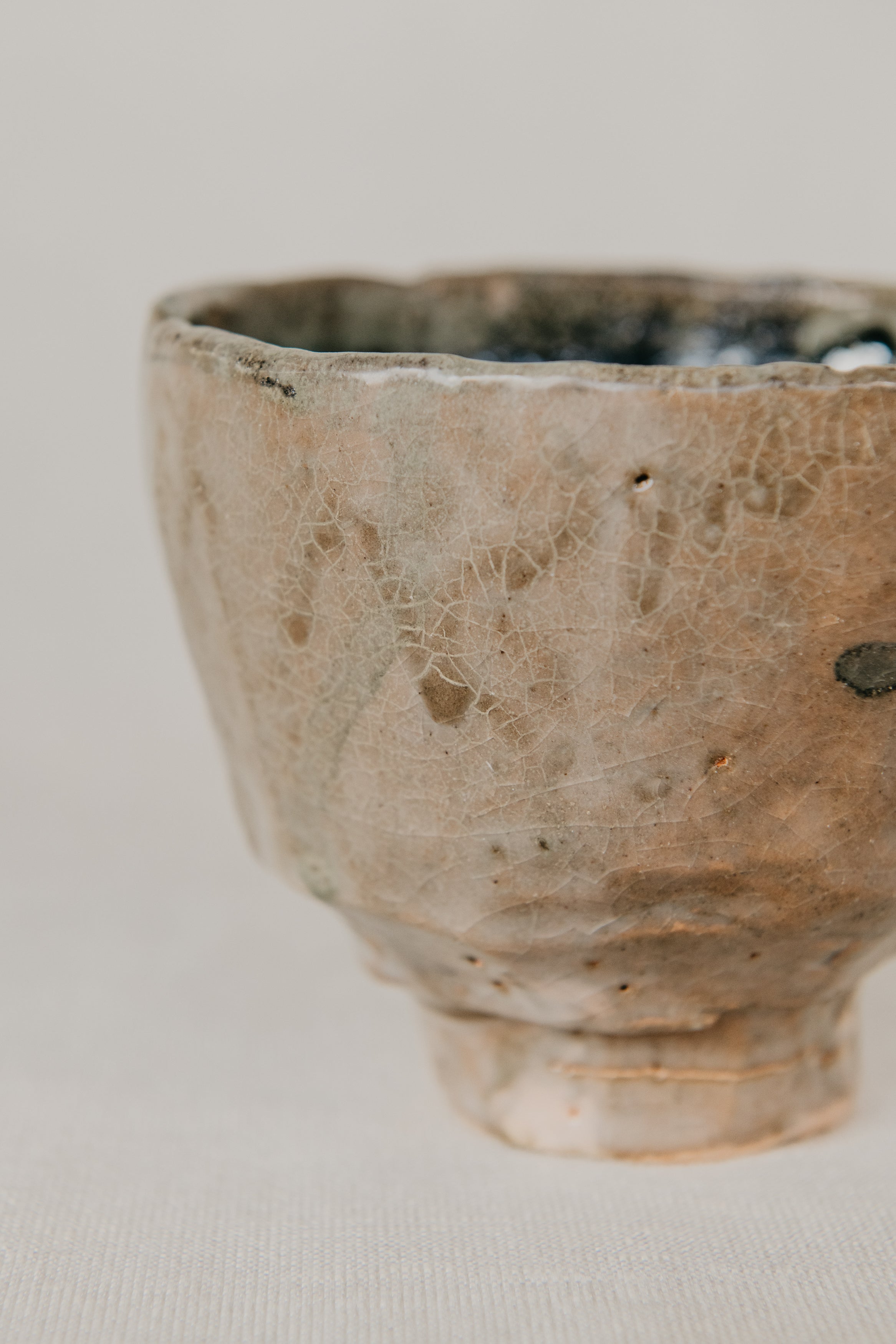 Ceramic bowl with textured surface on a plain background