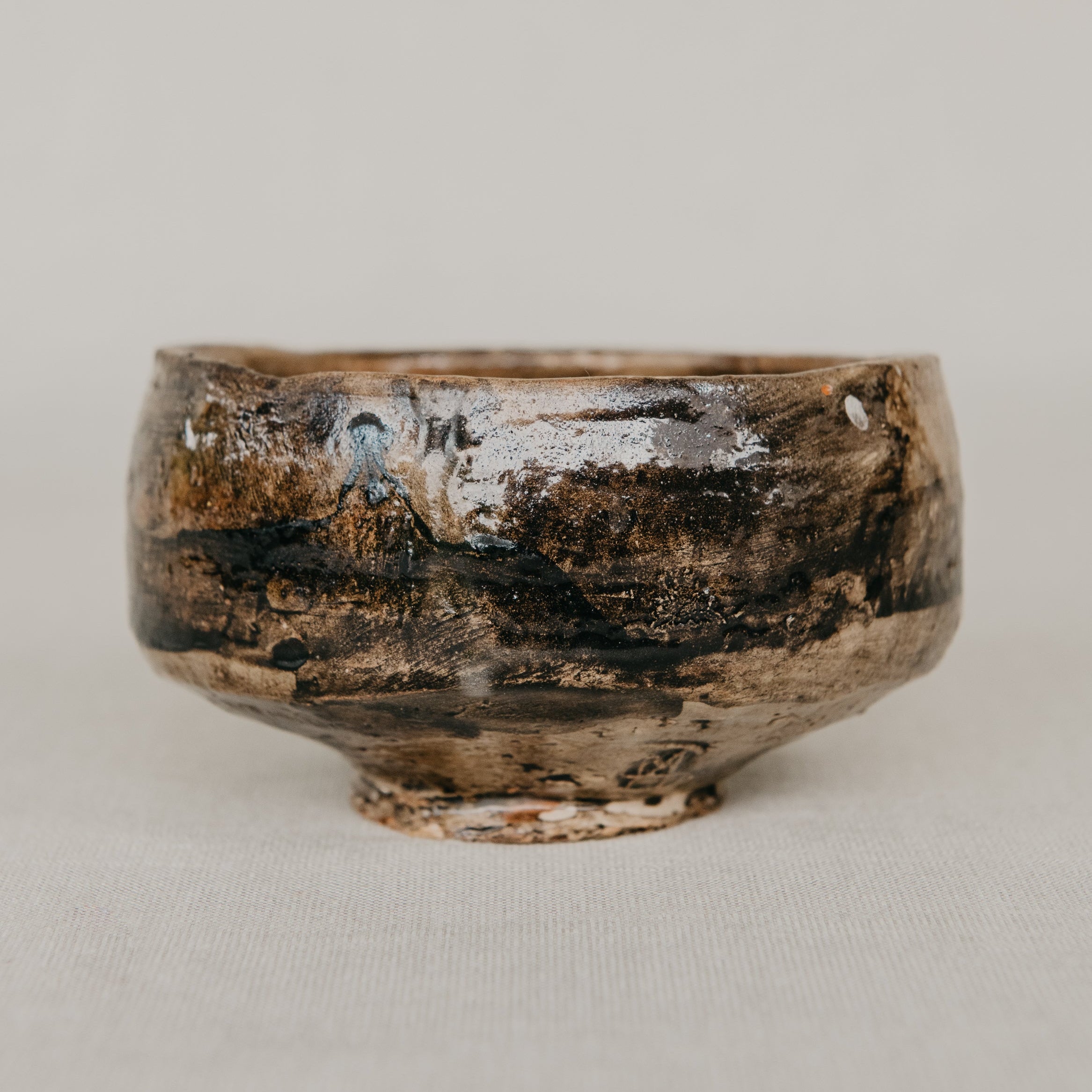 Rustic ceramic bowl on a light gray background