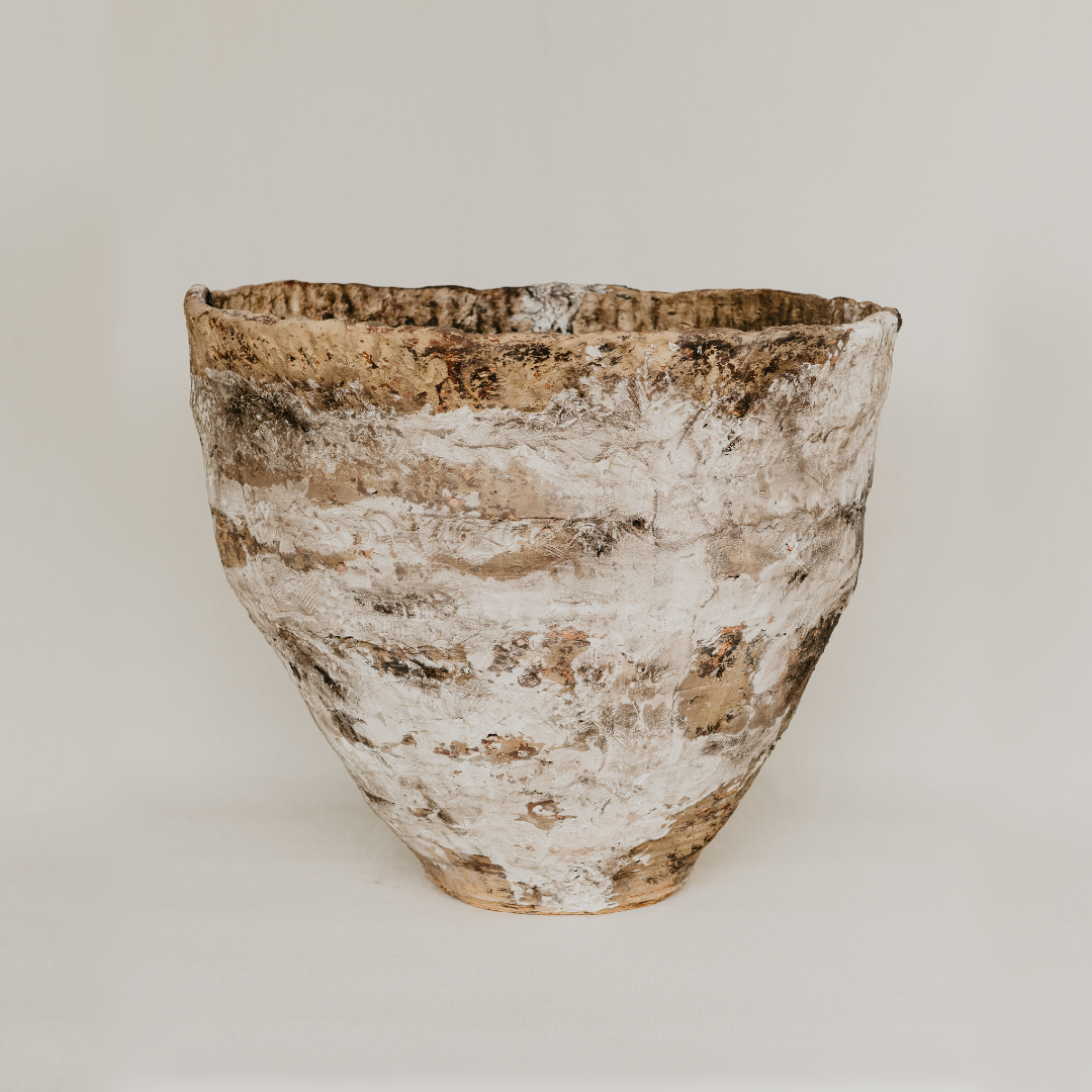 Textured ceramic bowl on a plain background