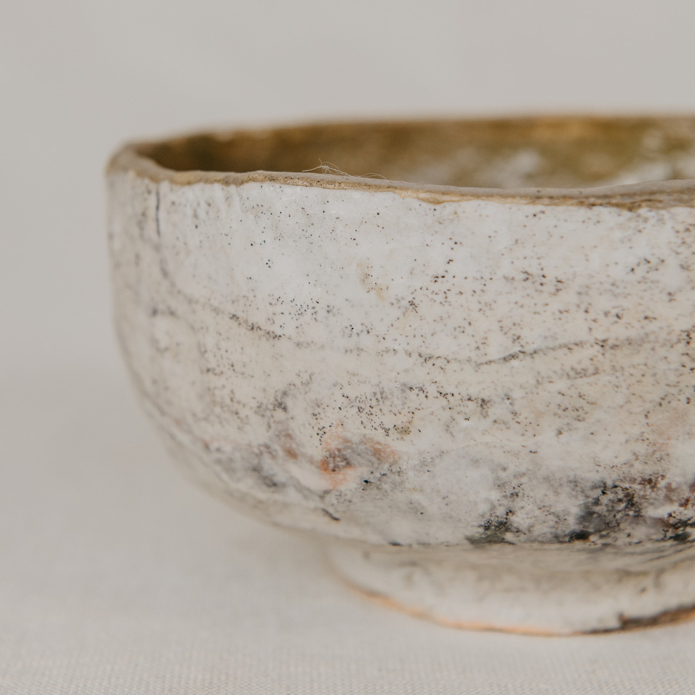 Ceramic bowl with textured surface on a light background