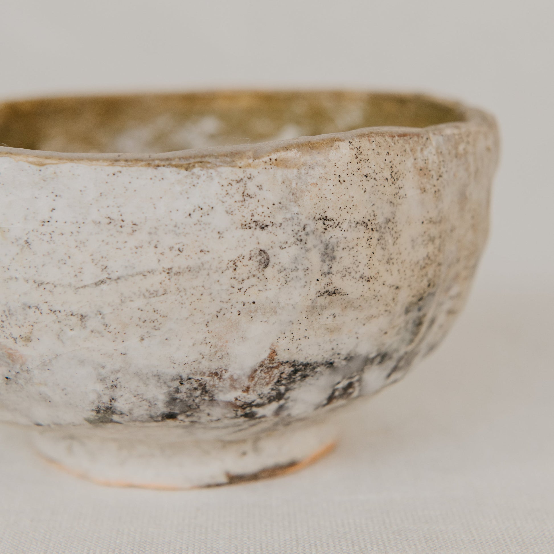 Ceramic bowl with a textured surface on a light background