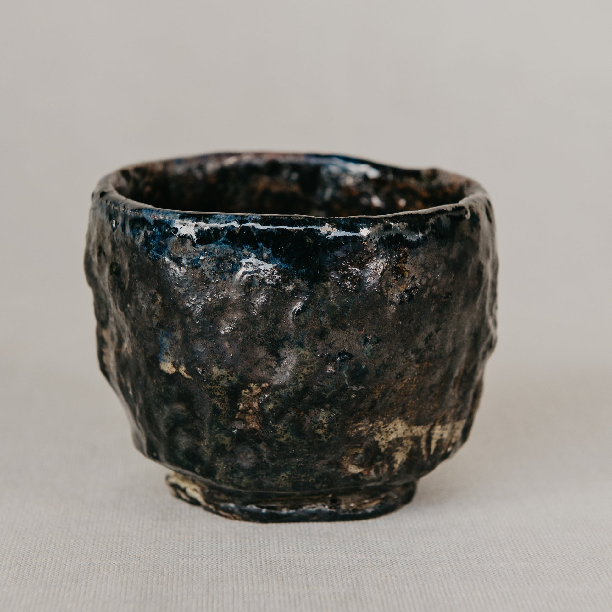 Black ceramic cup on a gray background