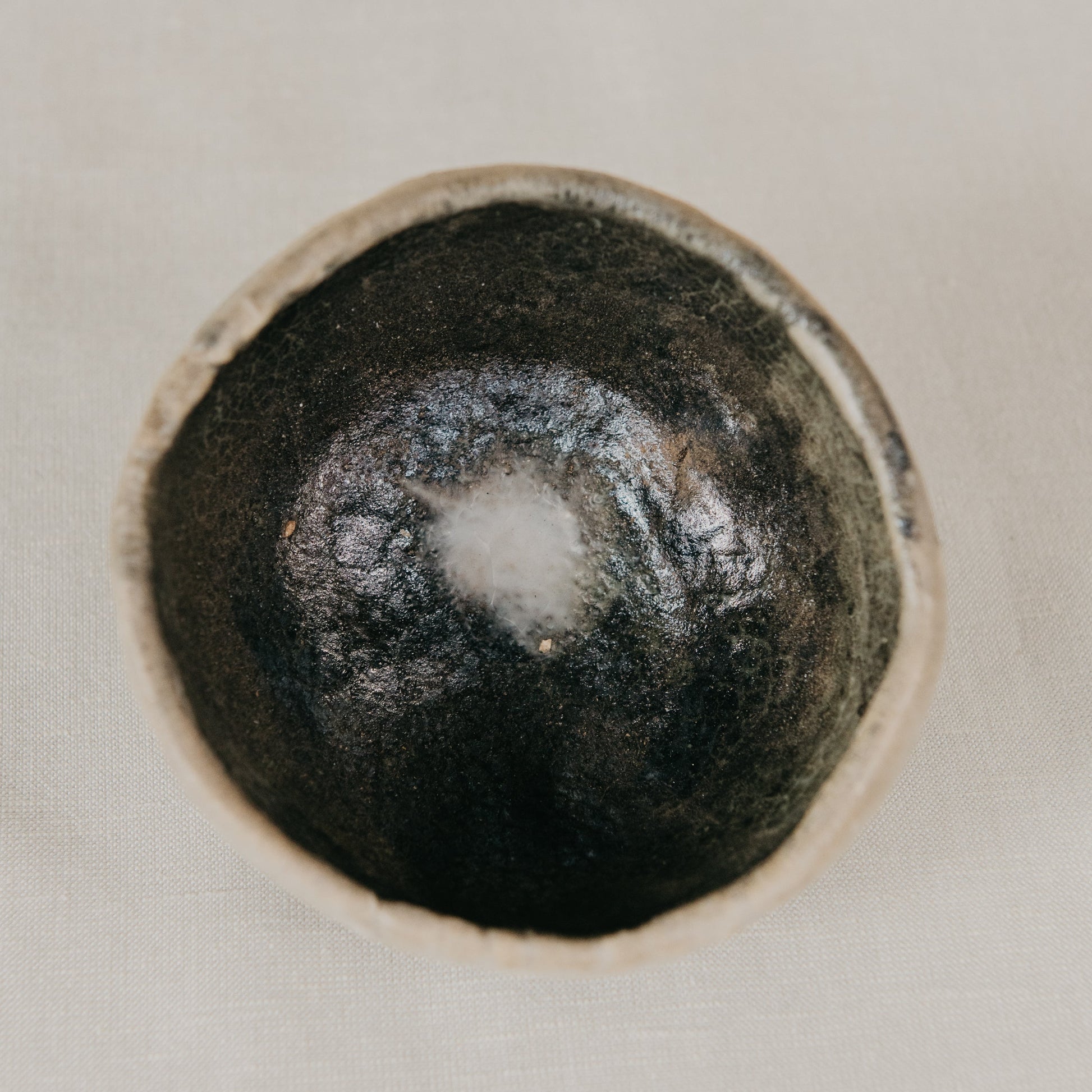 Black ceramic knob on a white background