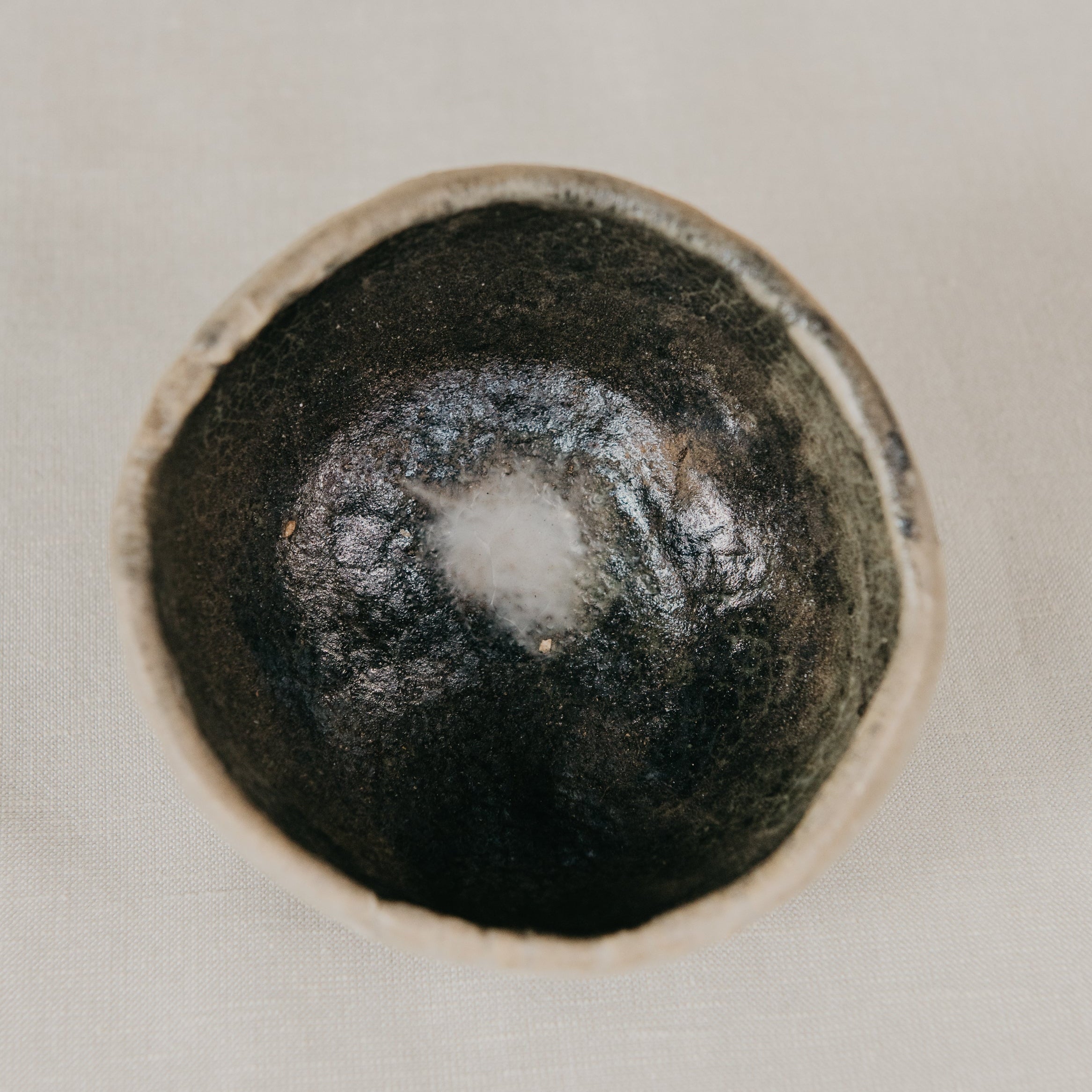 Black ceramic knob on a white background