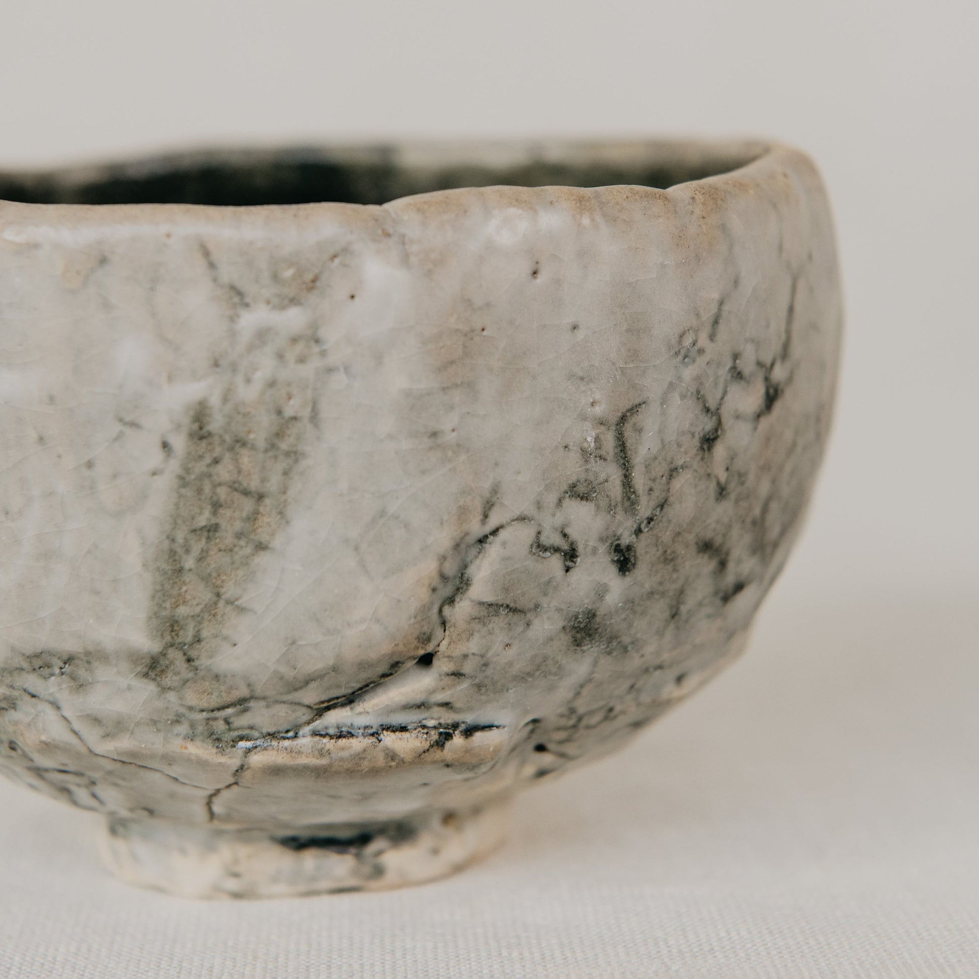 Ceramic bowl with a textured surface on a plain background