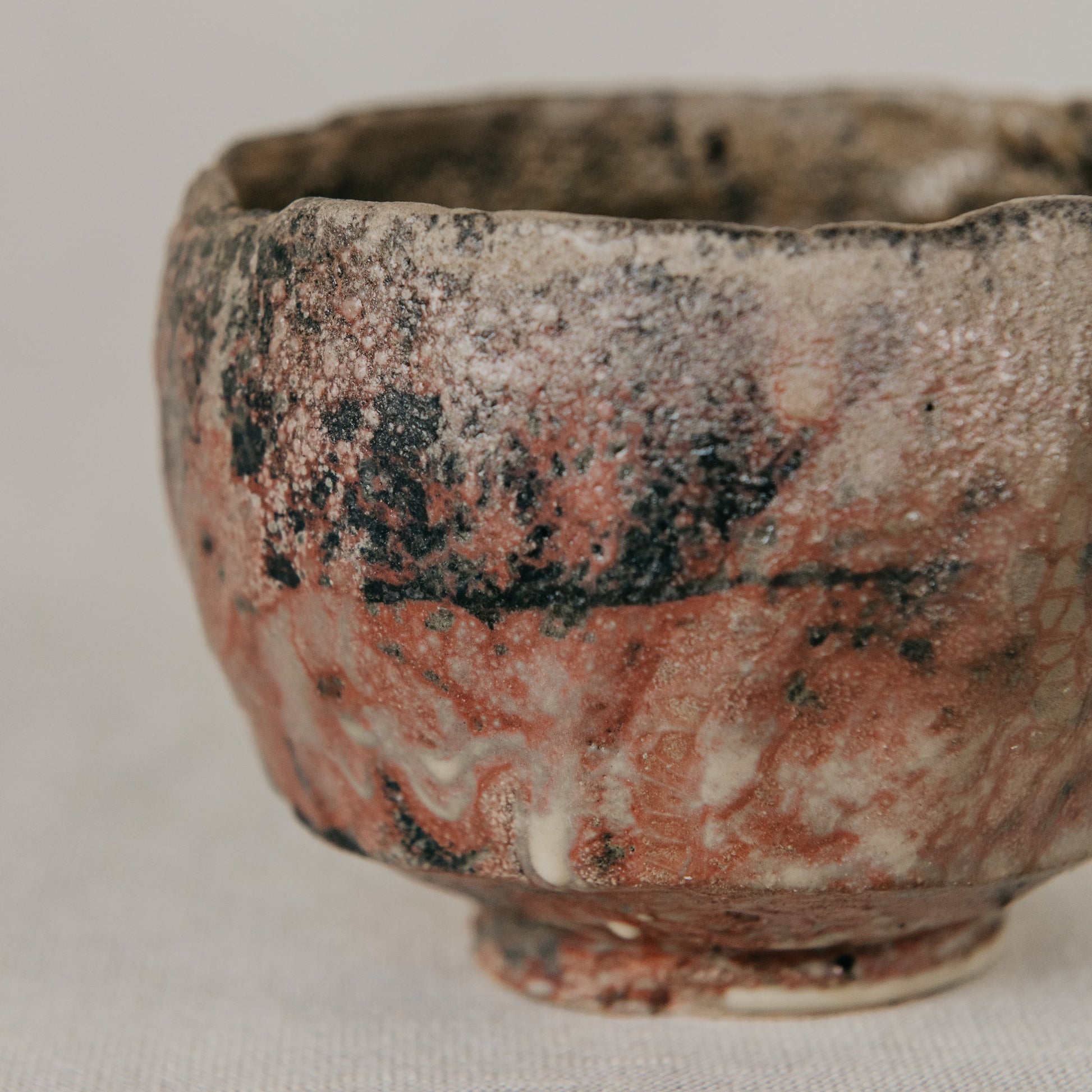 Ceramic cup with textured surface on a light background