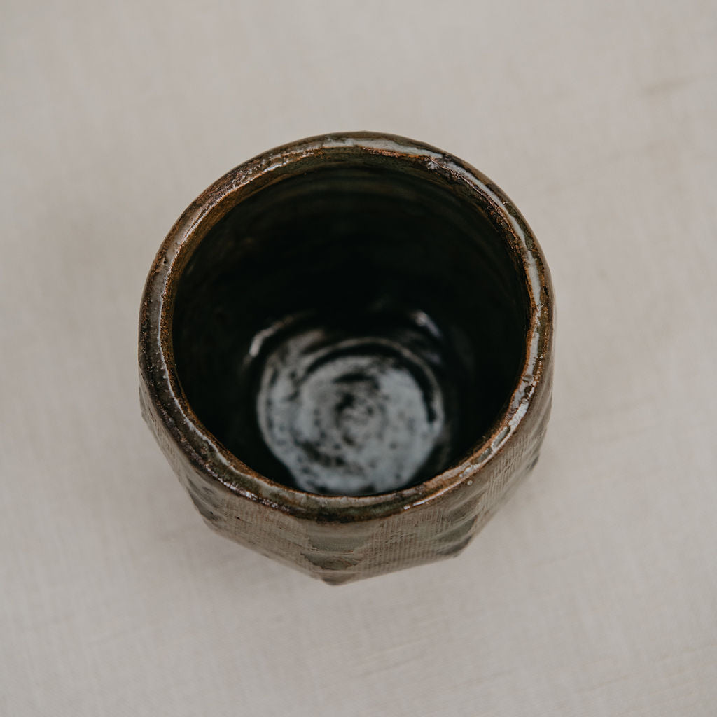 Ceramic cup on a light beige background