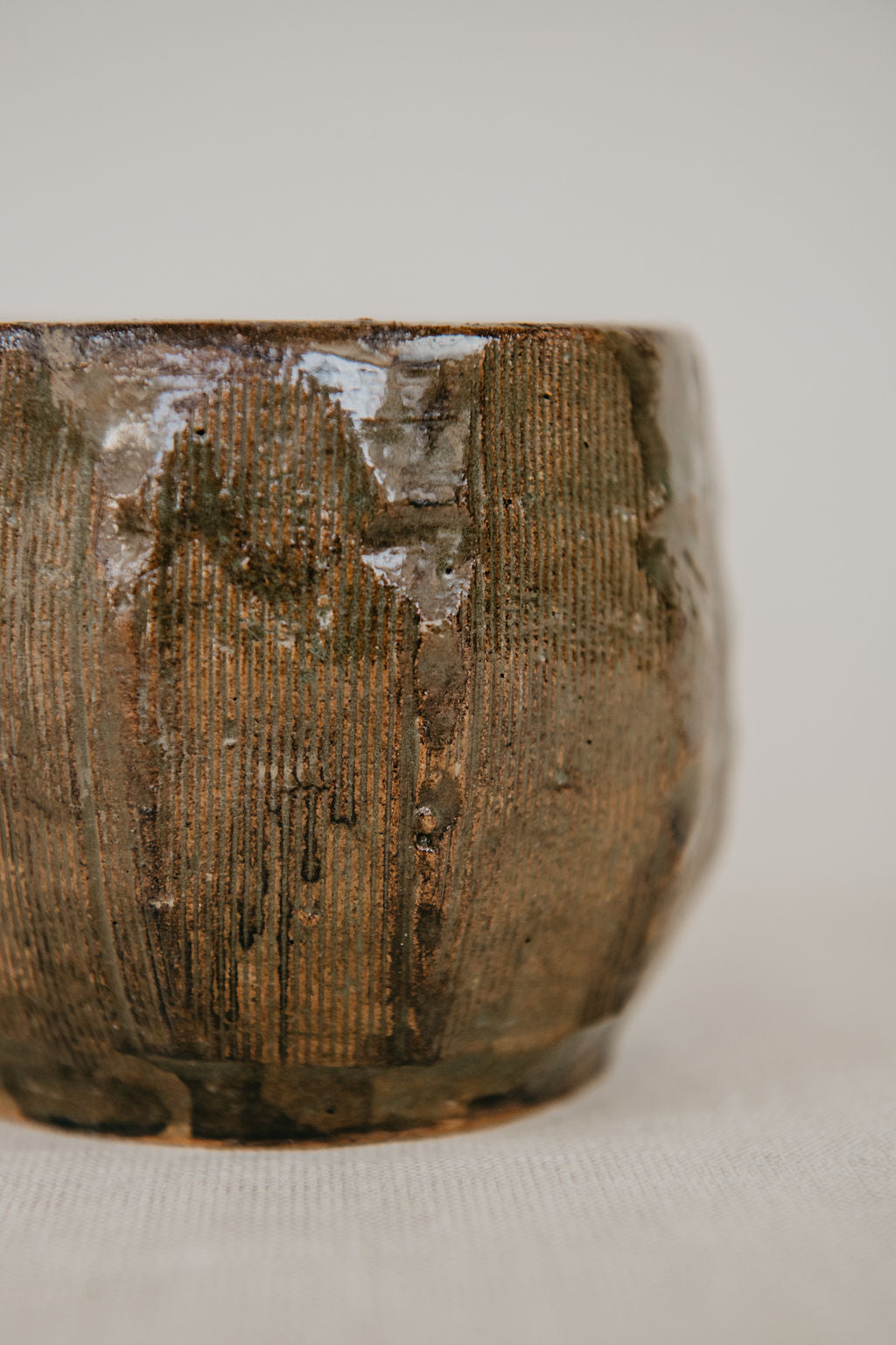Close-up of a textured ceramic bowl on a light background