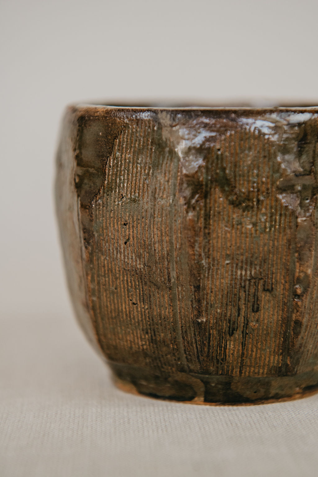 Close-up of a textured ceramic bowl on a light background