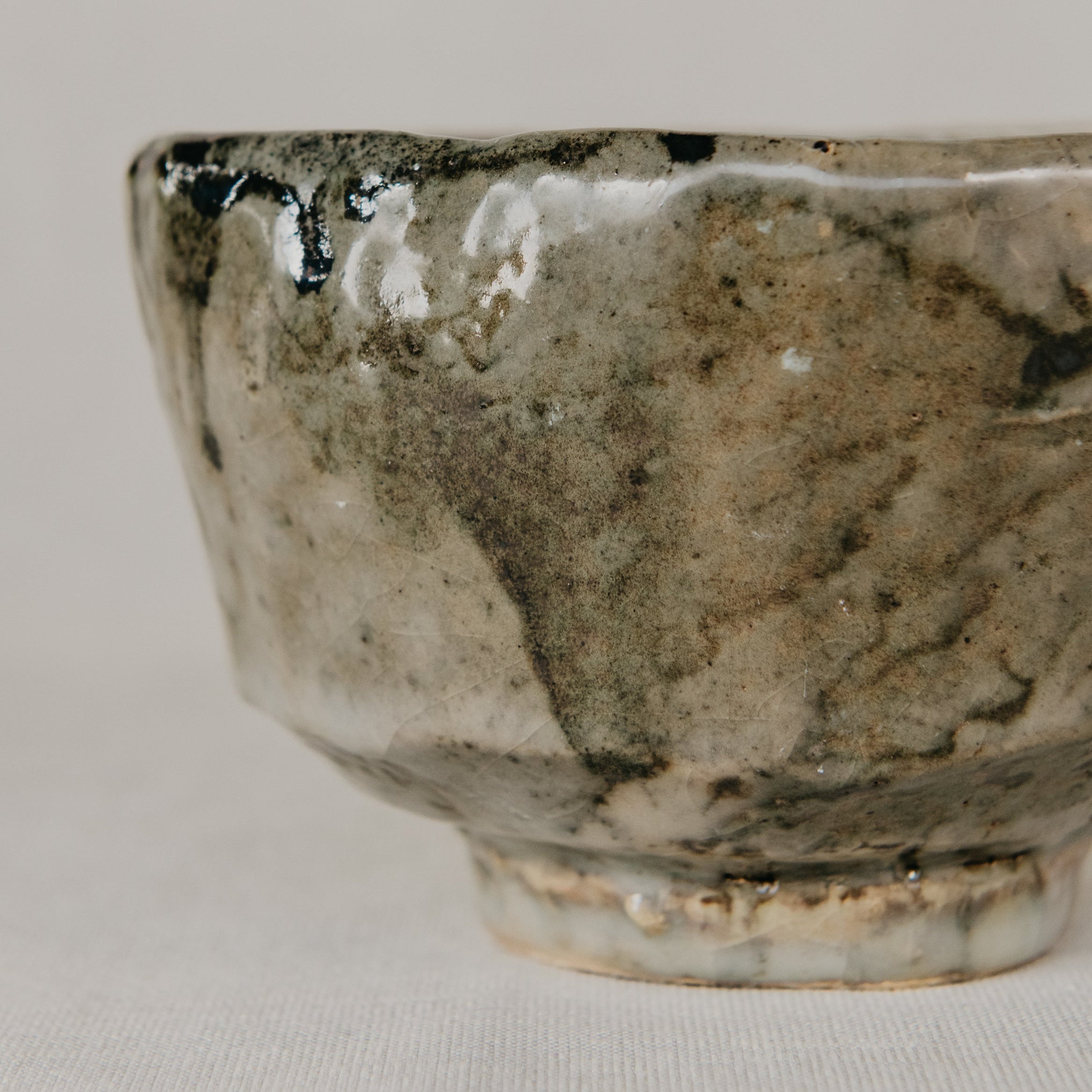 Ceramic bowl with a textured surface on a light gray background