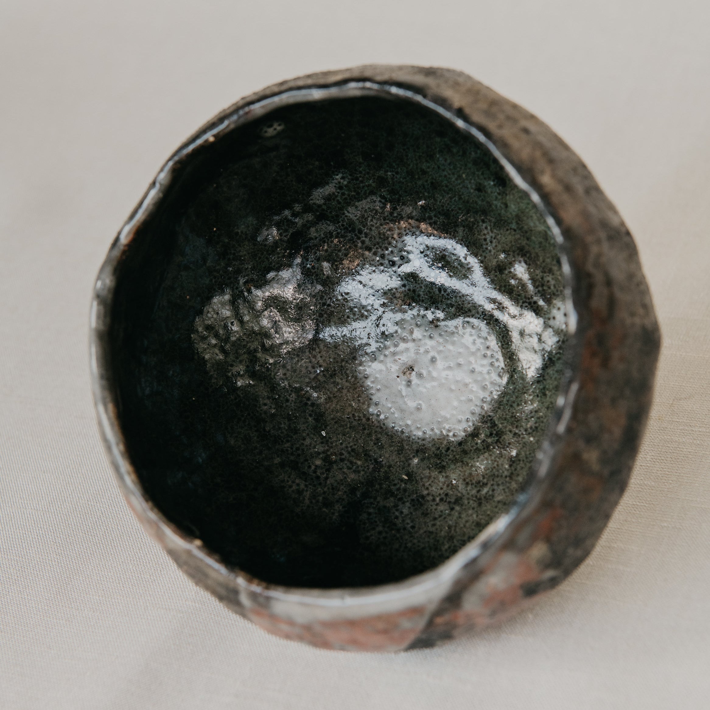 Ceramic bowl with a textured surface on a light background