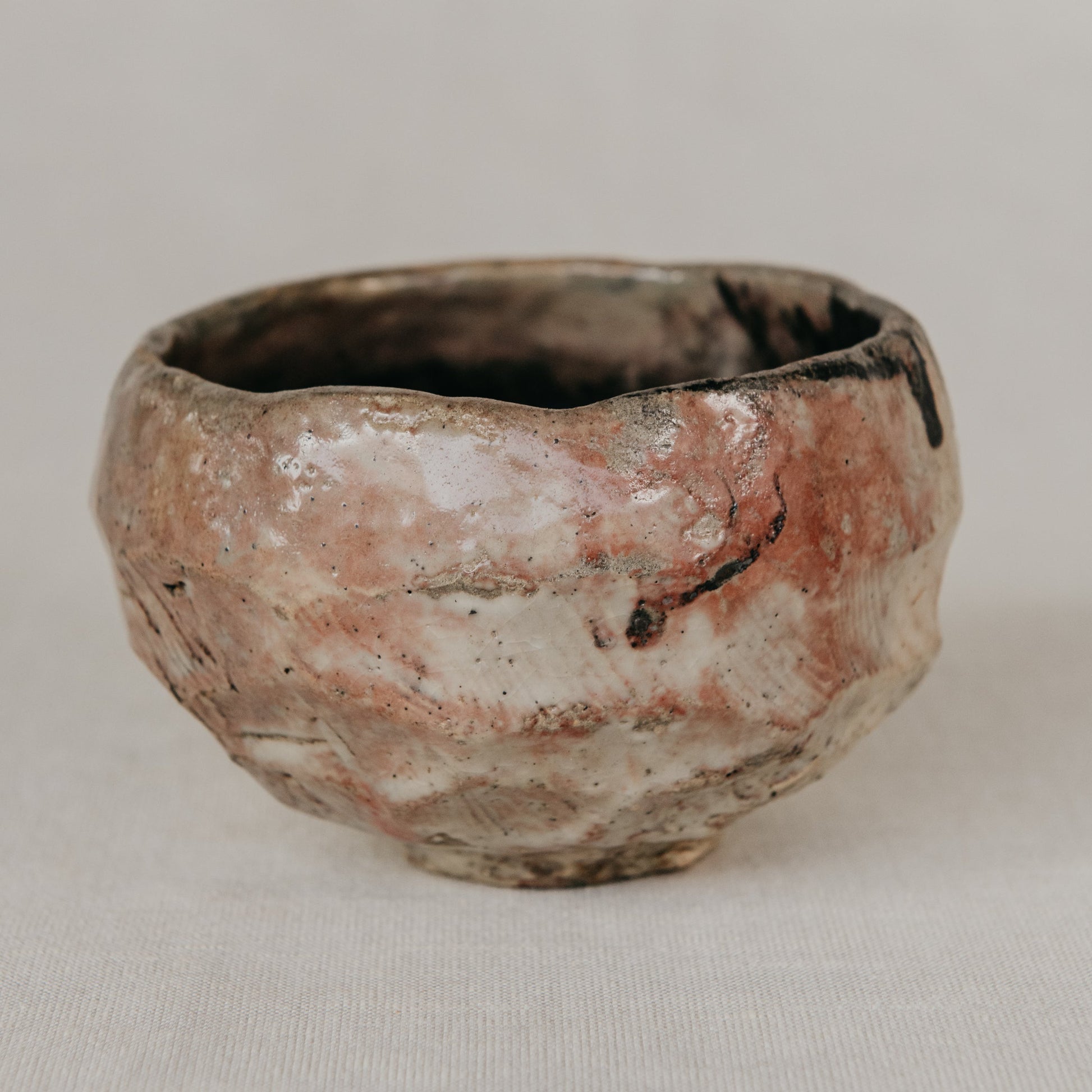 Small ceramic bowl with a textured surface on a neutral background