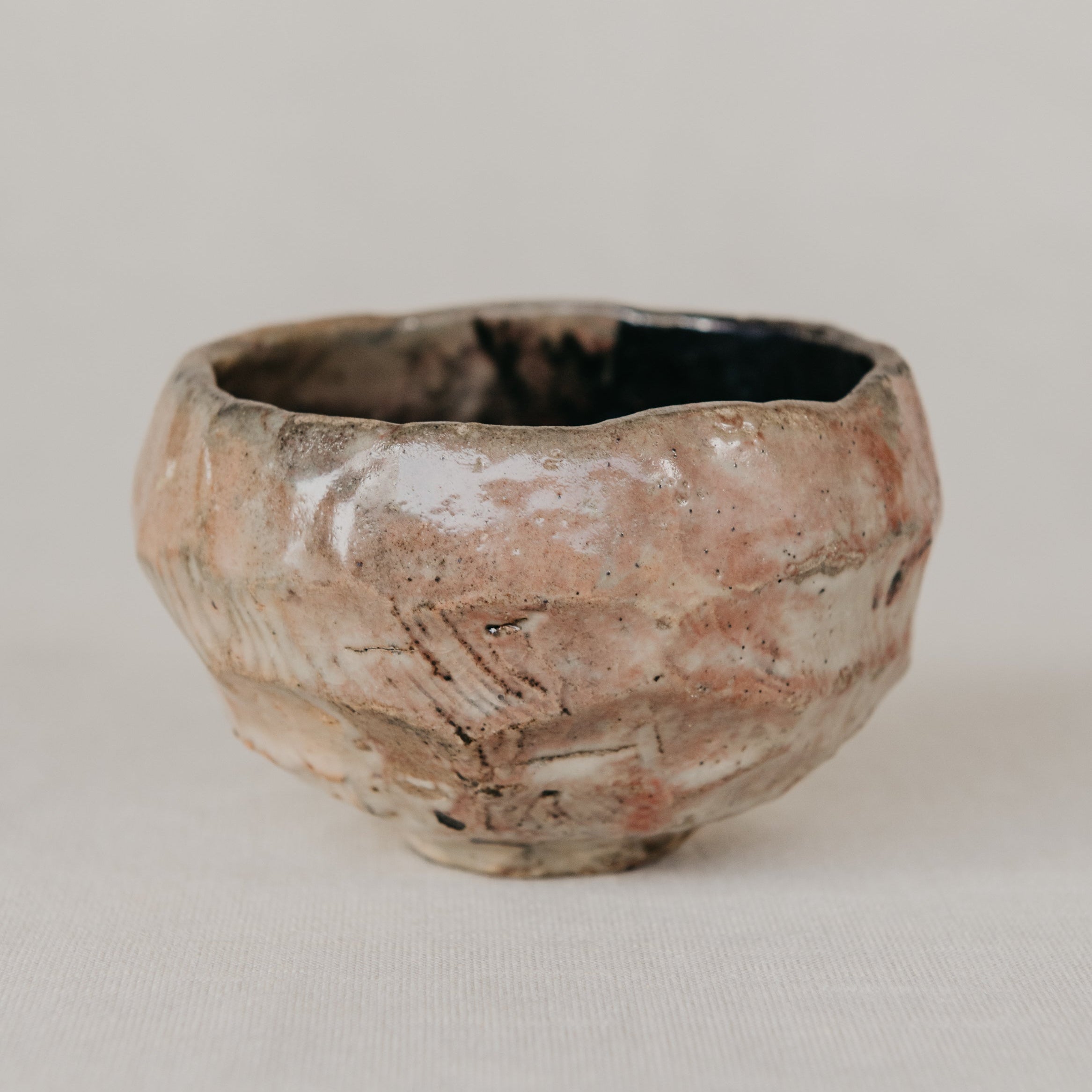 Small terracotta pot on a light beige background