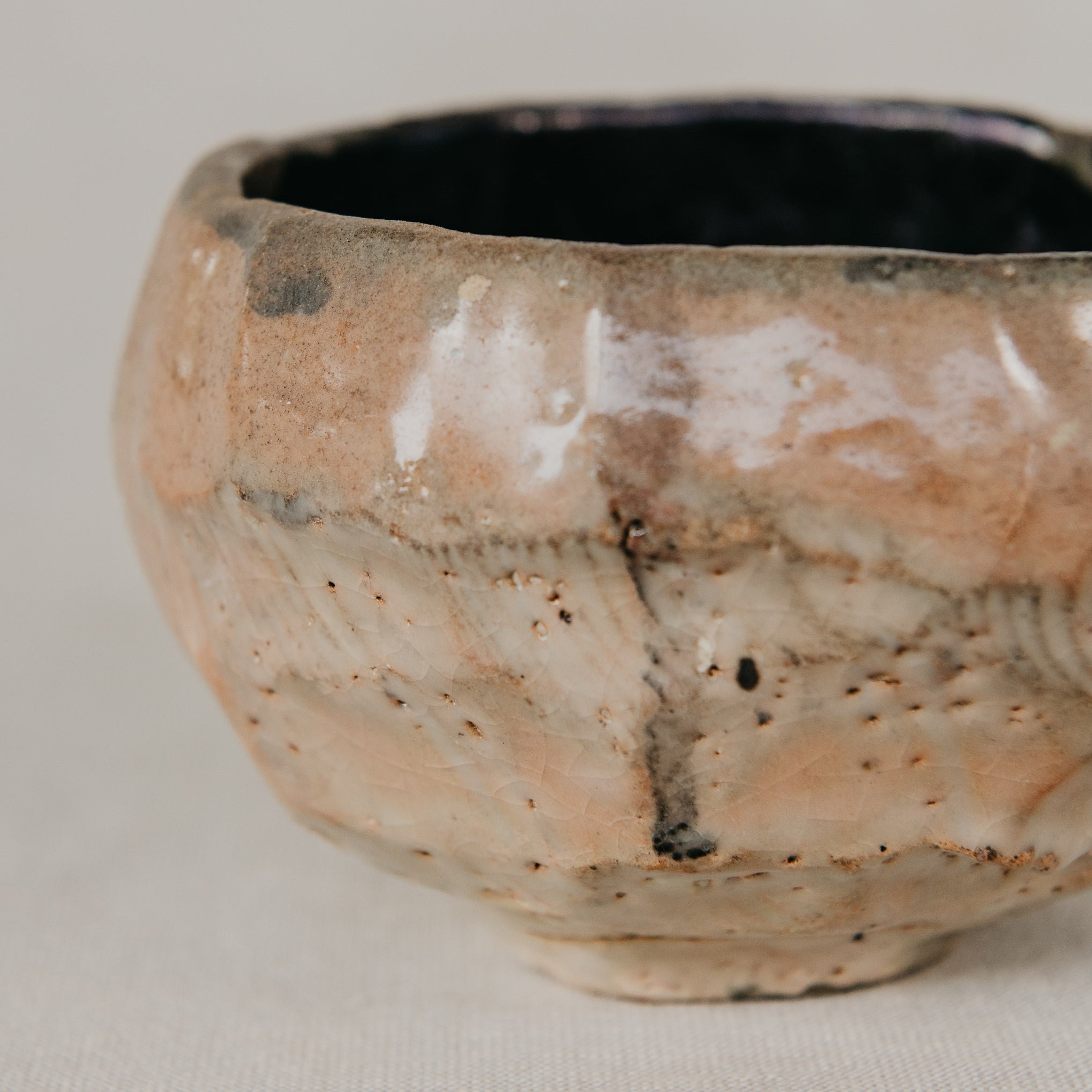 Ceramic bowl with a textured surface on a neutral background