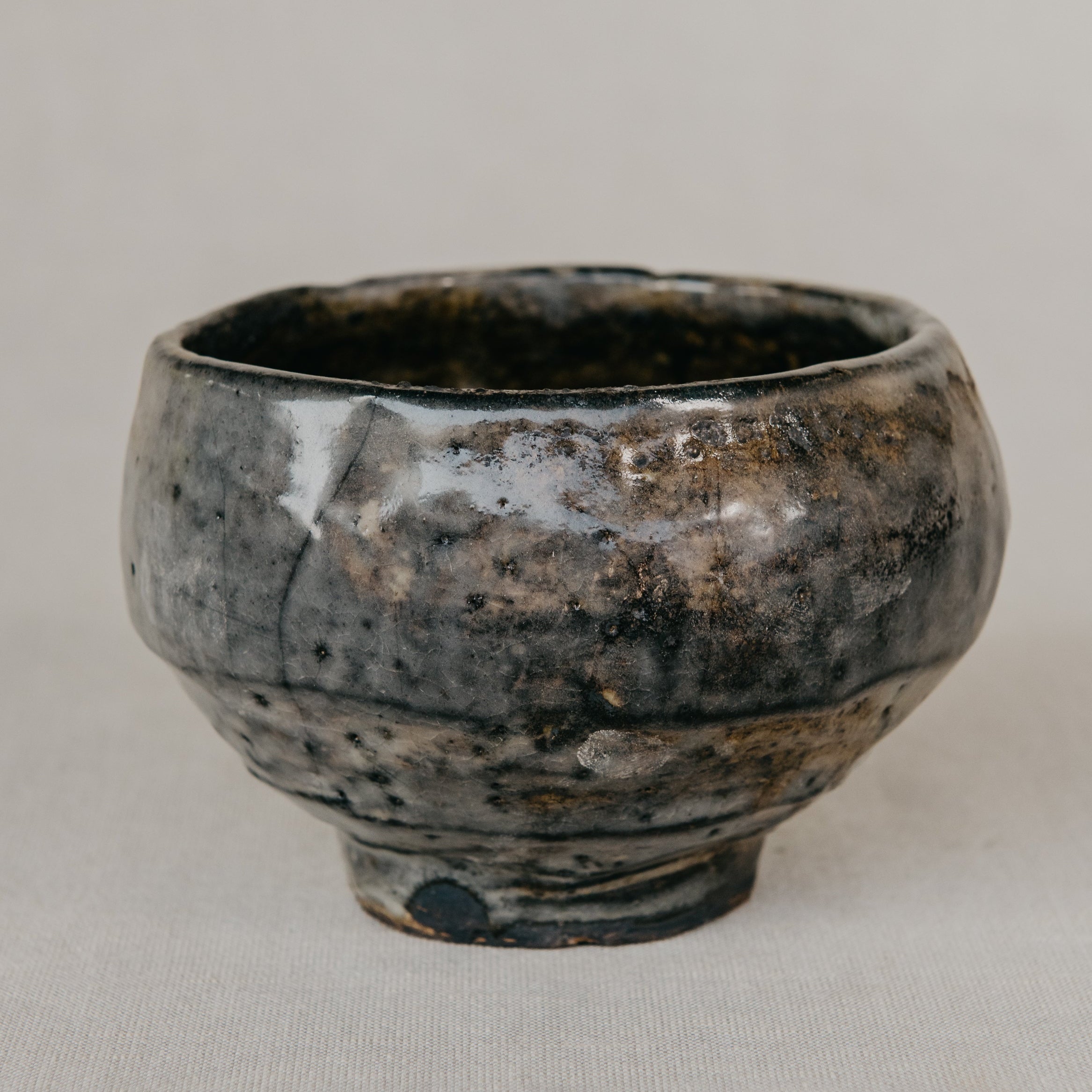 Black ceramic cup on a light gray background