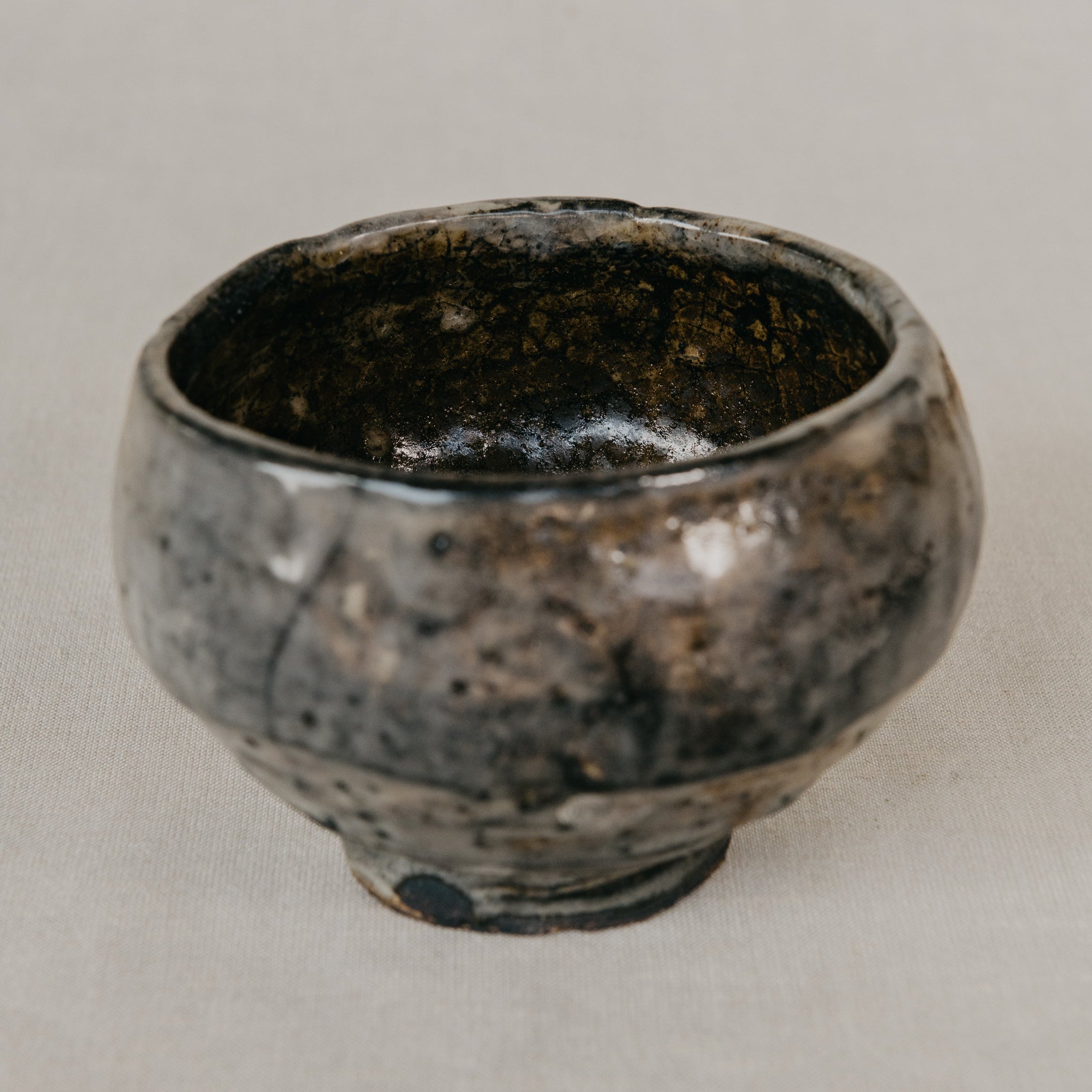 Black ceramic bowl on a light gray background