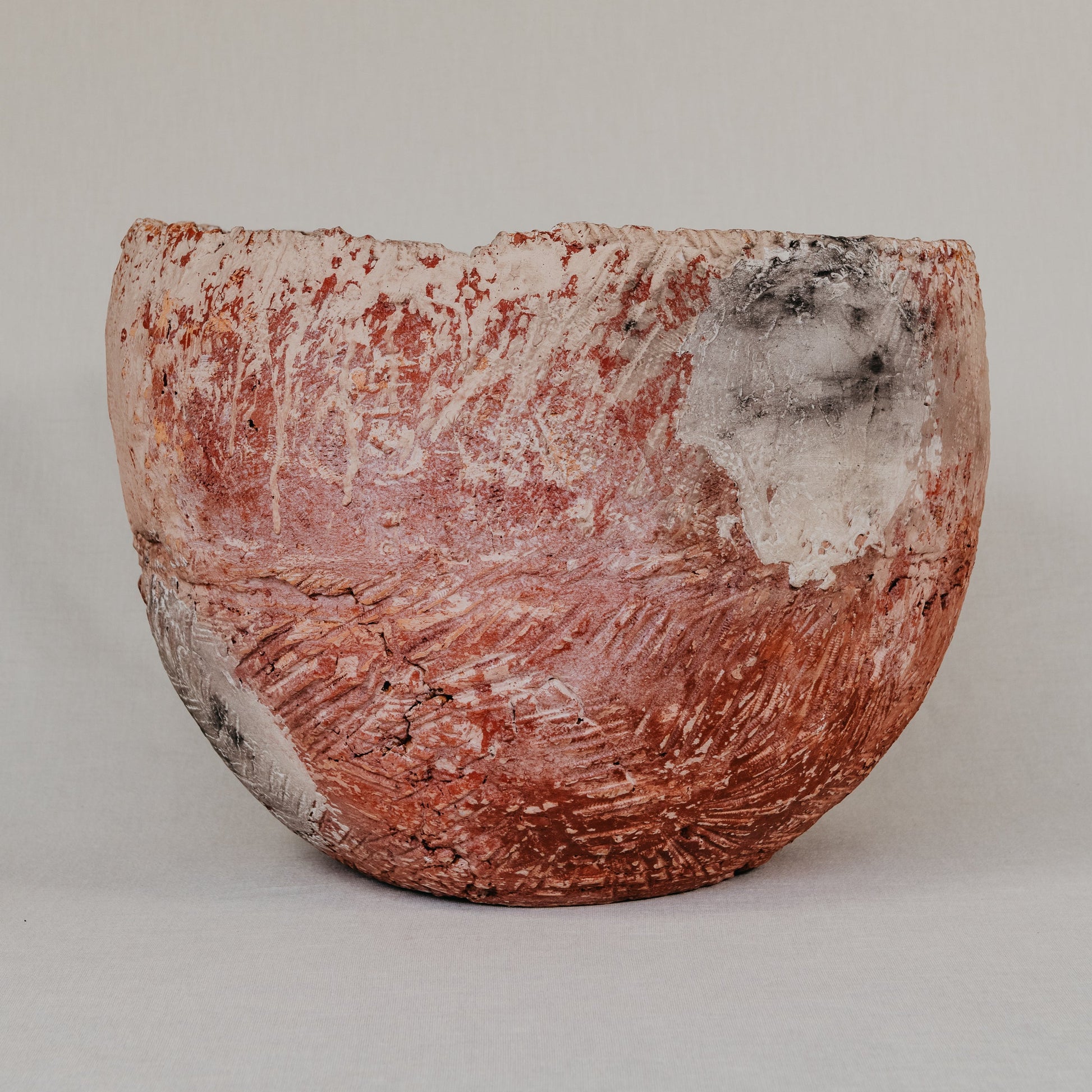 Textured ceramic bowl on a plain background