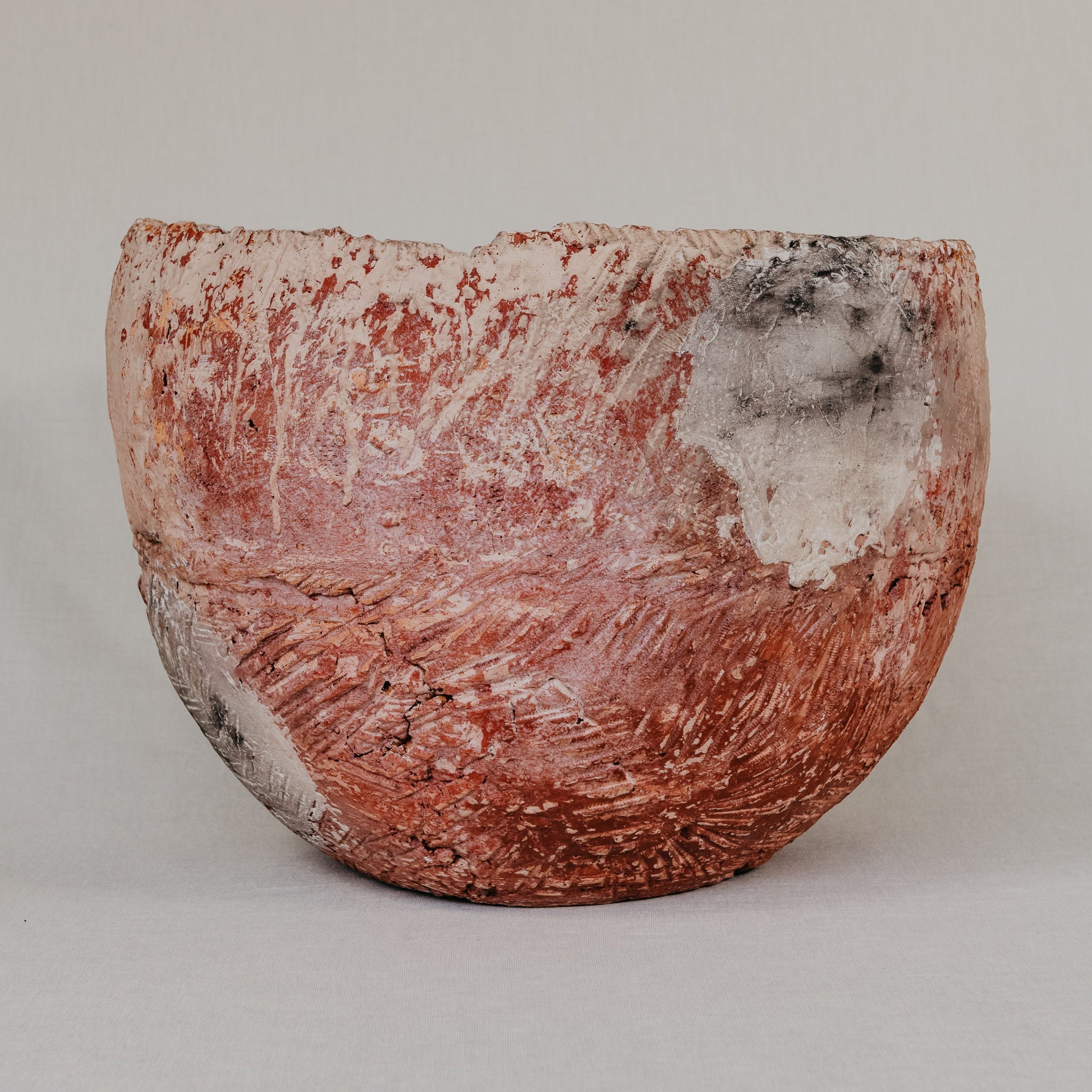 Textured ceramic bowl on a plain background