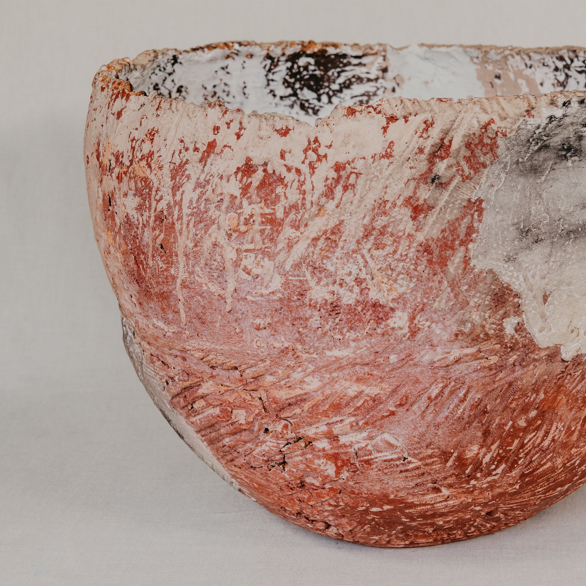 Ceramic bowl with textured surface on a plain background