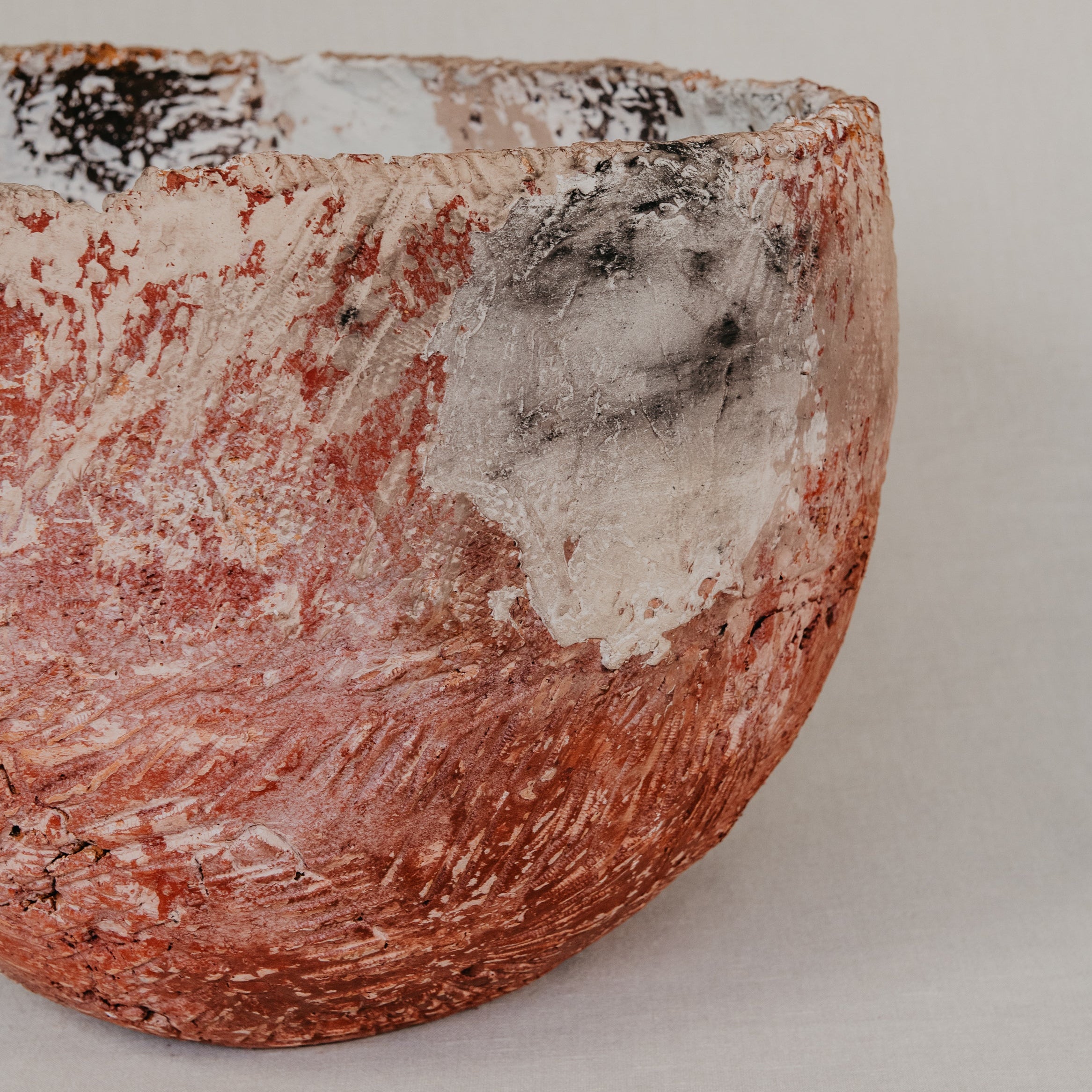 Ceramic bowl with textured surface on a plain background