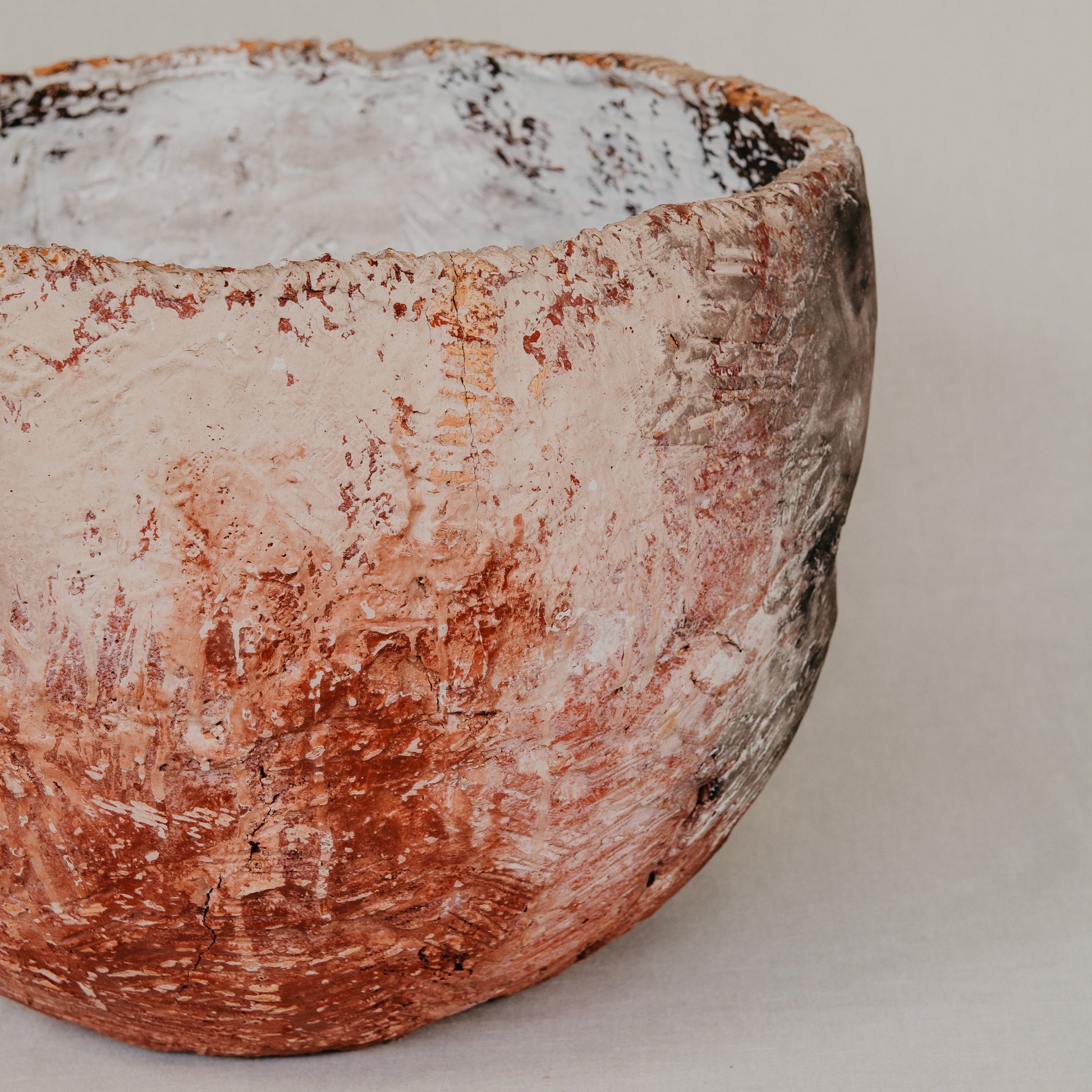 Ceramic bowl with a textured surface on a plain background