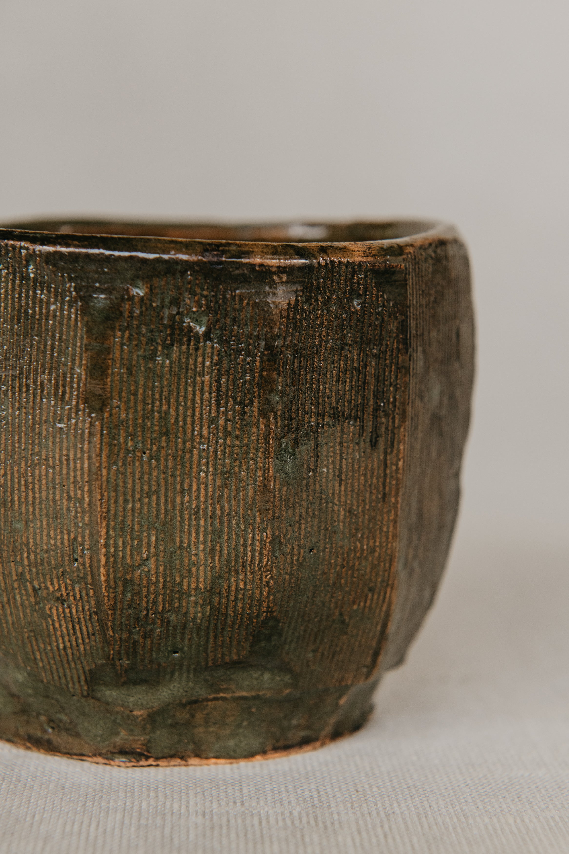 Textured ceramic bowl on a neutral background
