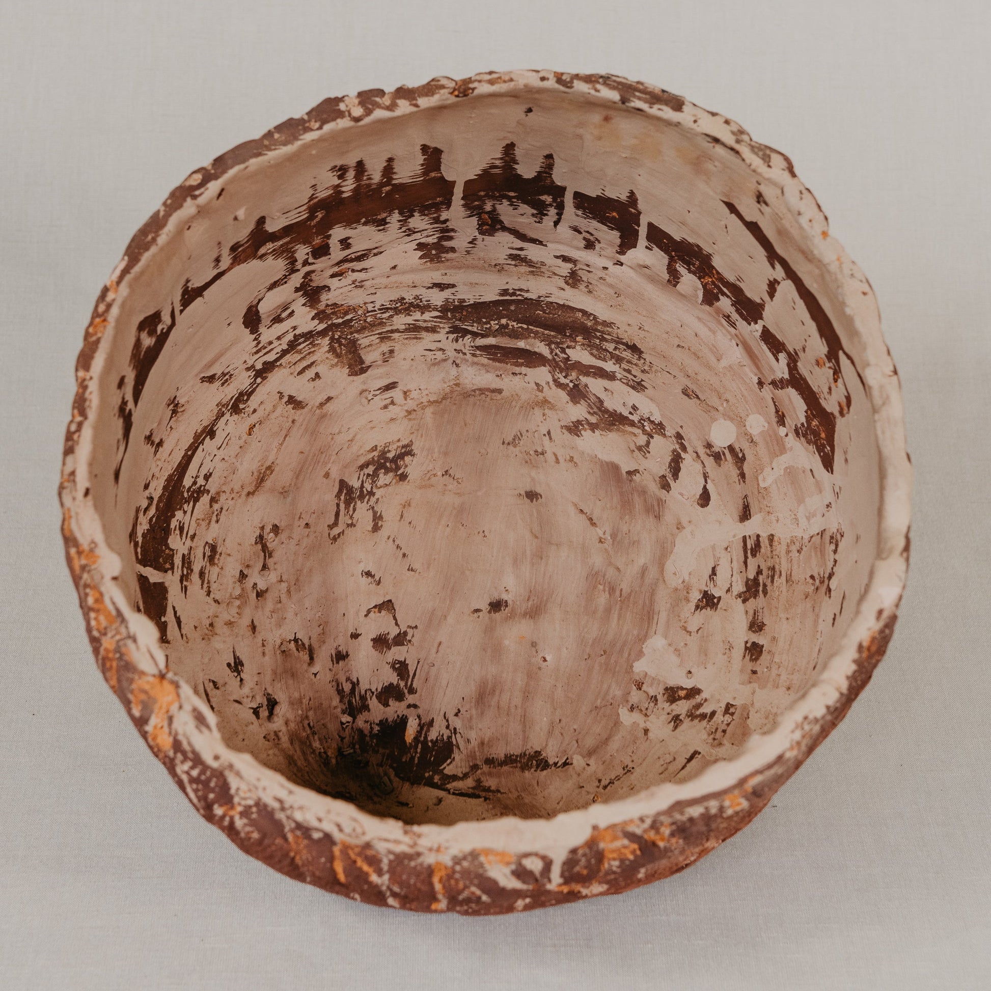 Ceramic bowl with textured surface on a plain background