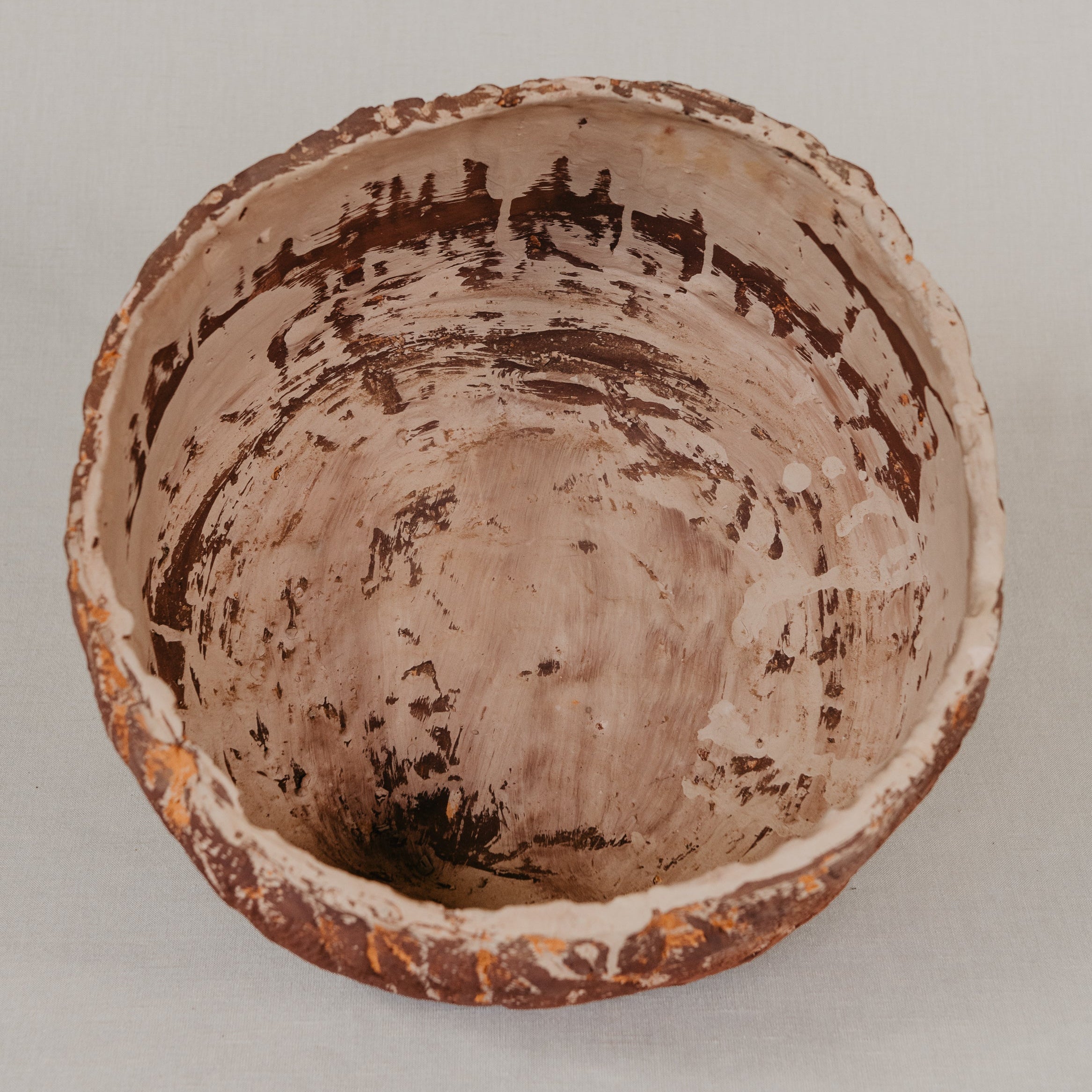 Ceramic bowl with textured surface on a plain background