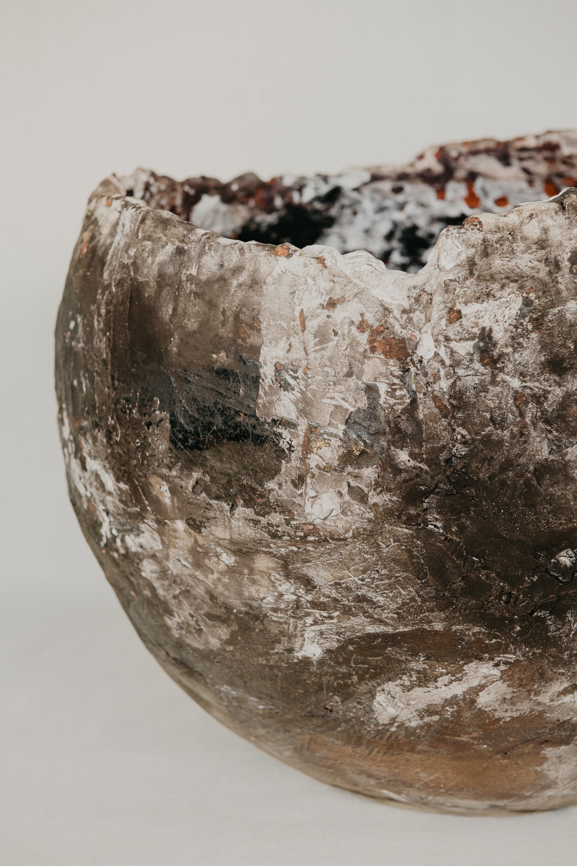 Vintage ceramic bowl with a textured surface on a plain background
