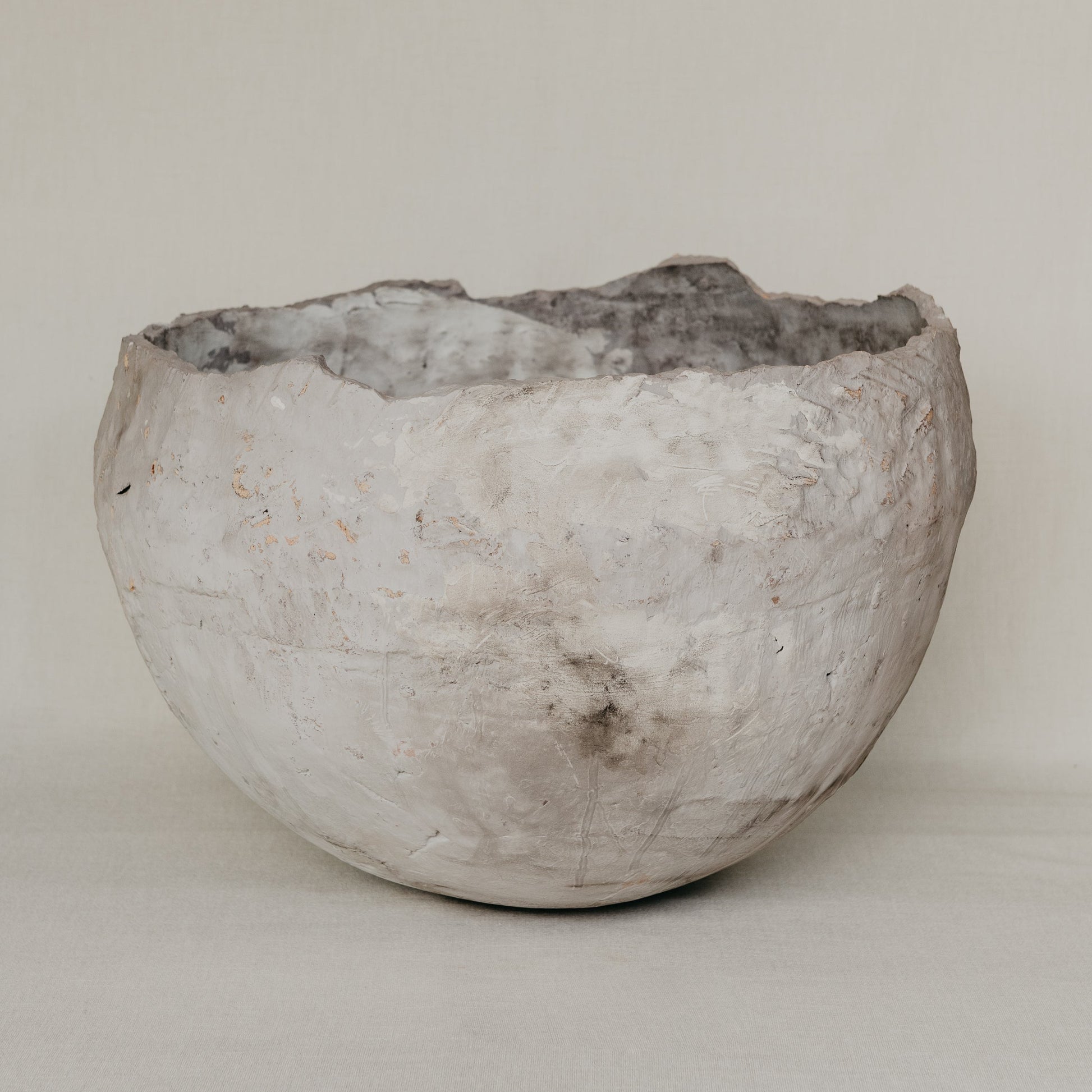 Textured ceramic bowl on a plain background