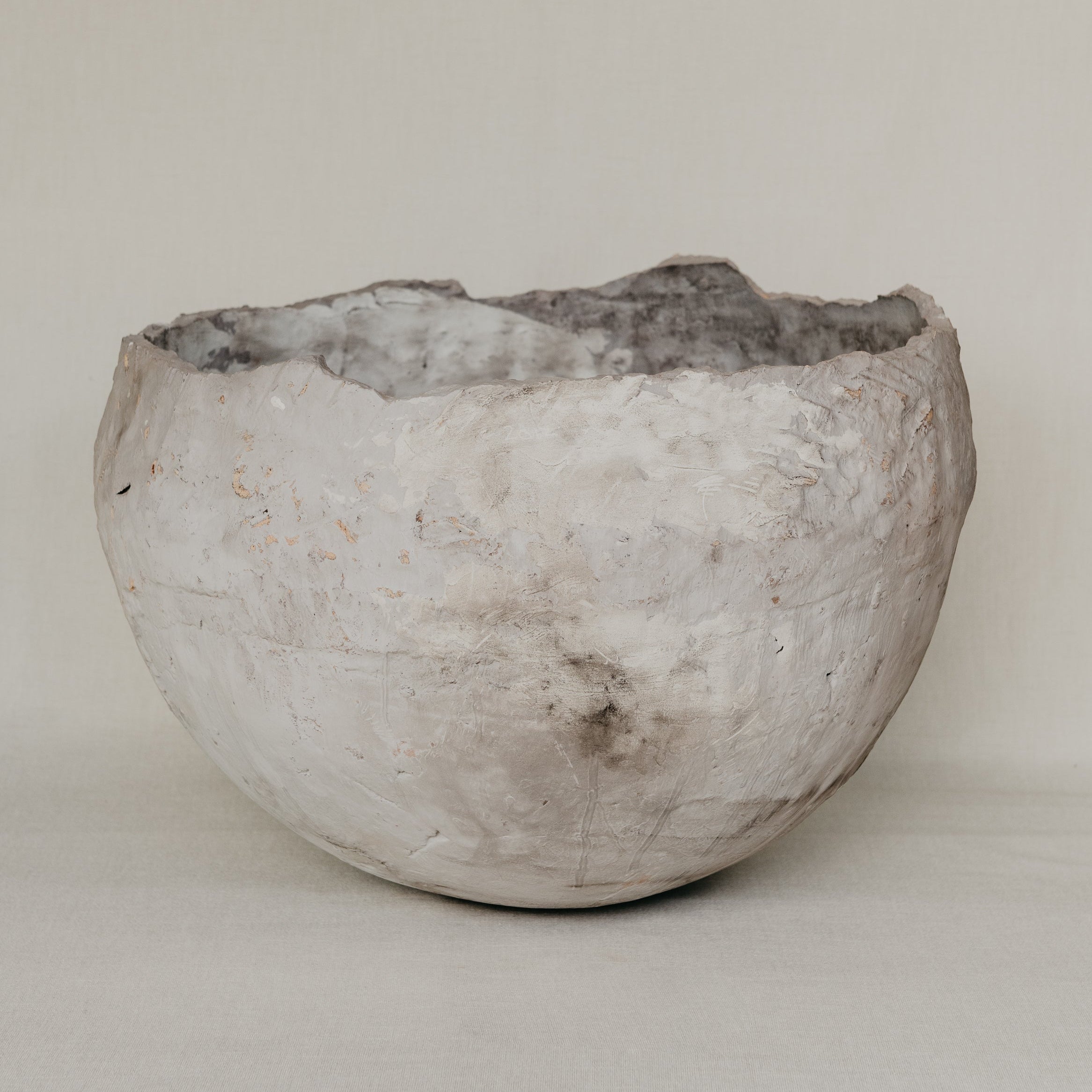 Textured ceramic bowl on a plain background