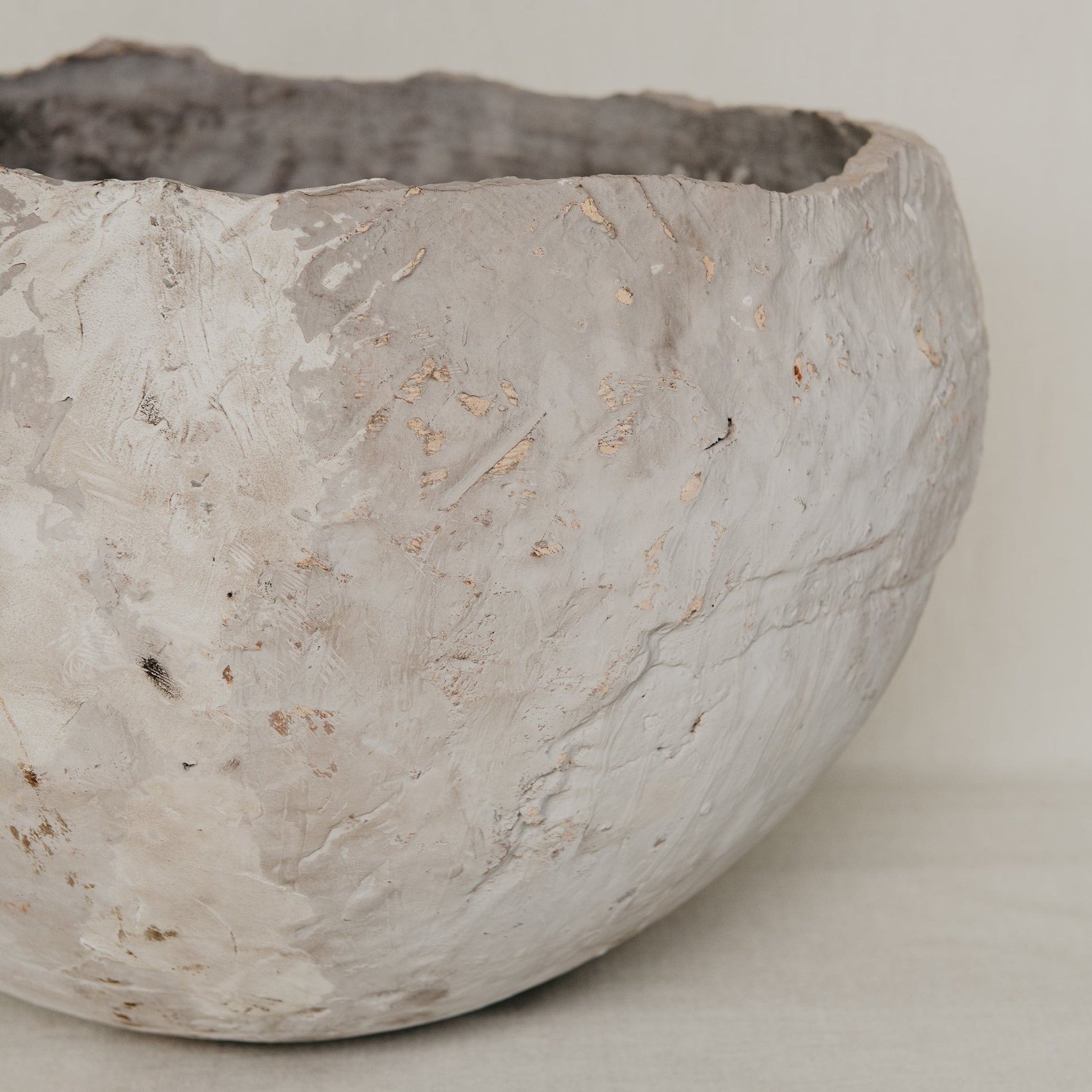 Textured ceramic bowl on a plain background