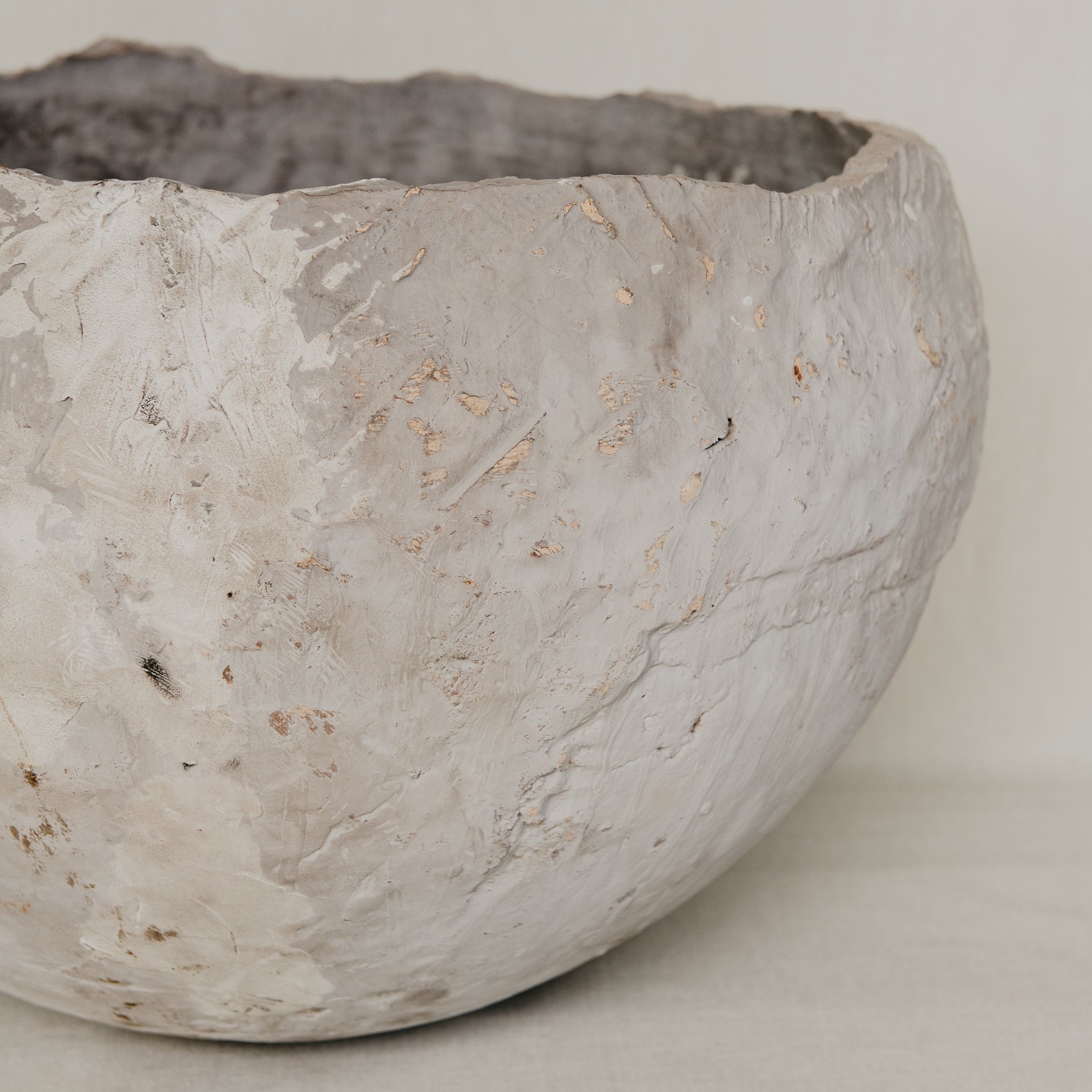 Textured ceramic bowl on a plain background