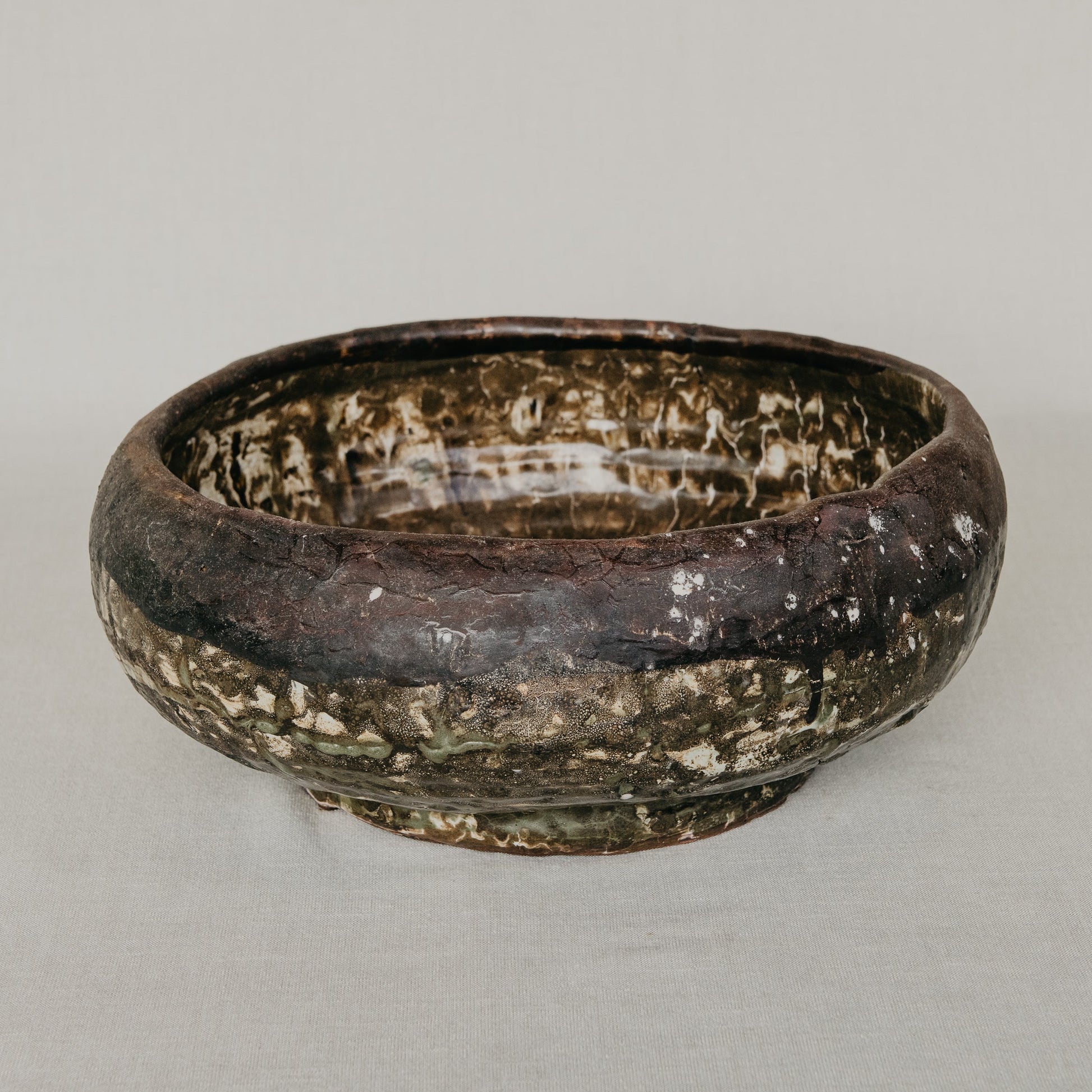 Rustic ceramic bowl on a plain background