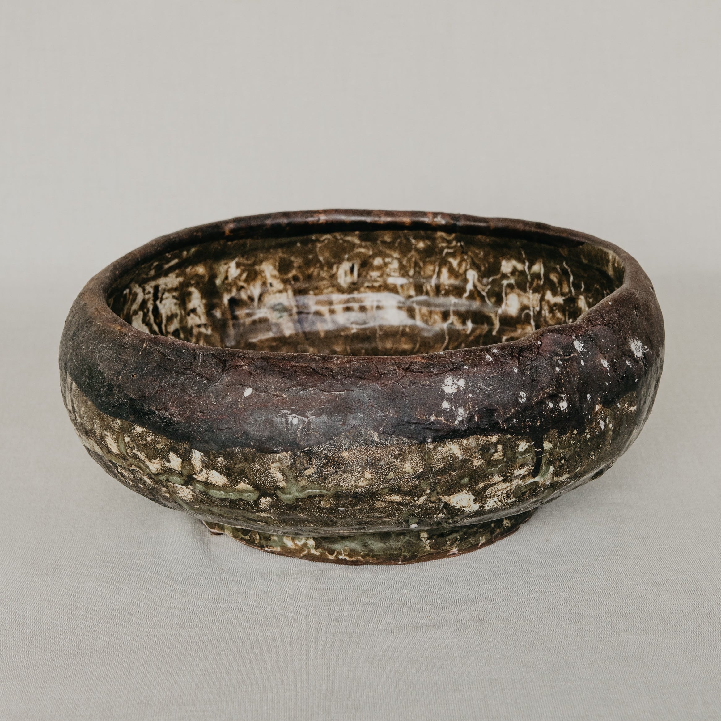 Rustic ceramic bowl on a plain background
