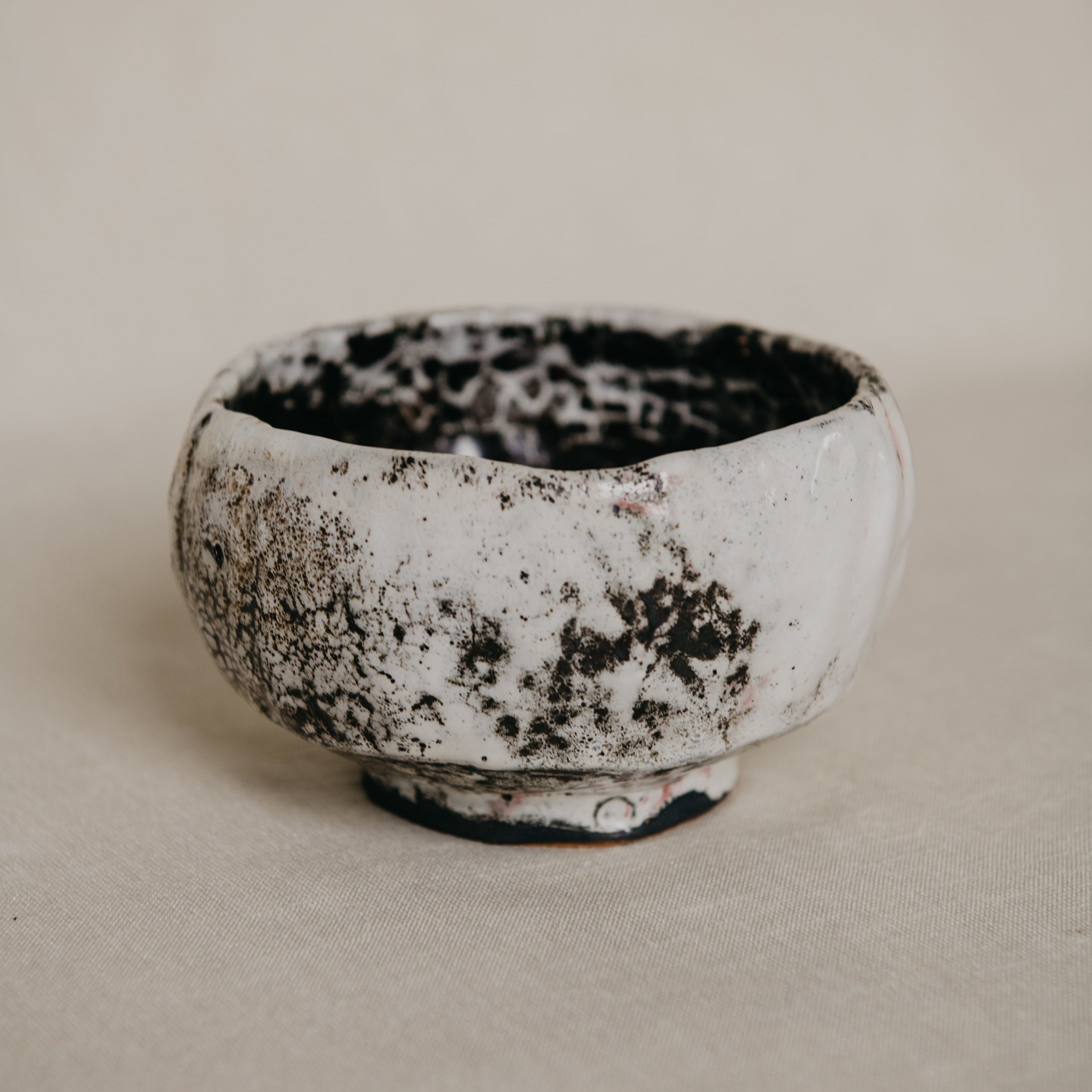 Ceramic bowl with a textured surface on a plain background