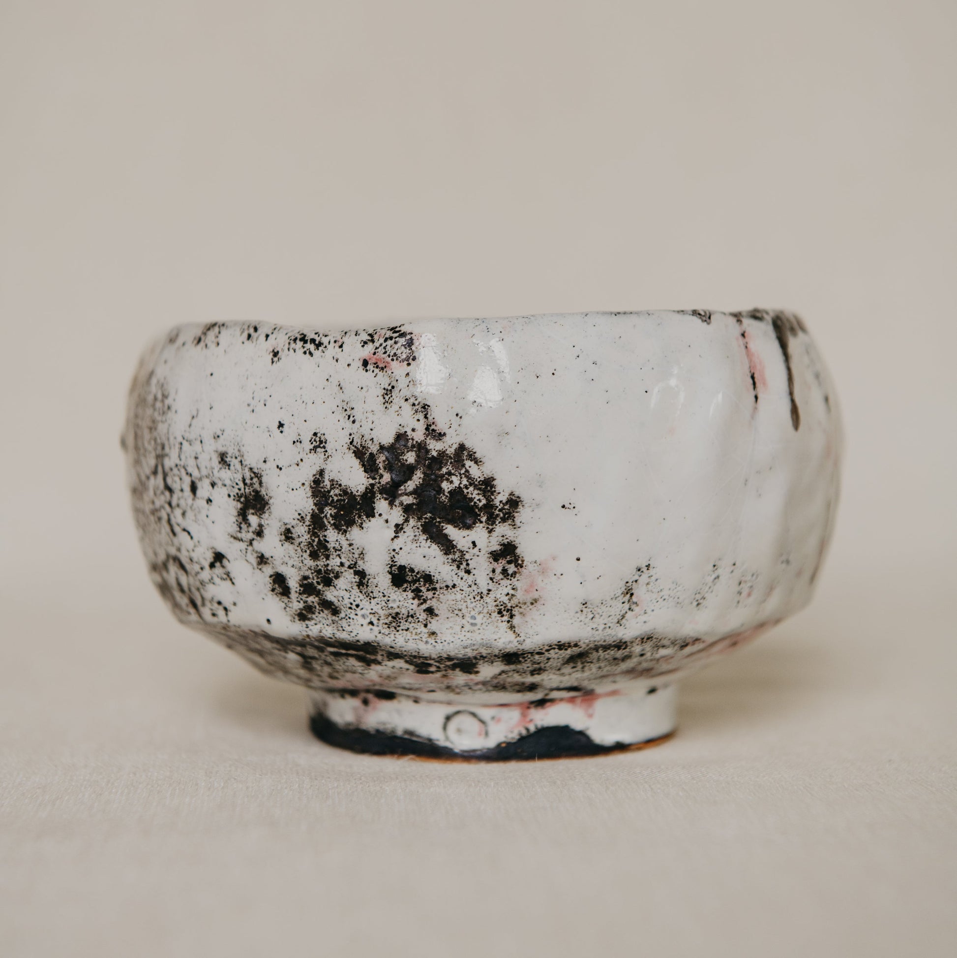 Ceramic bowl with textured surface on a plain background