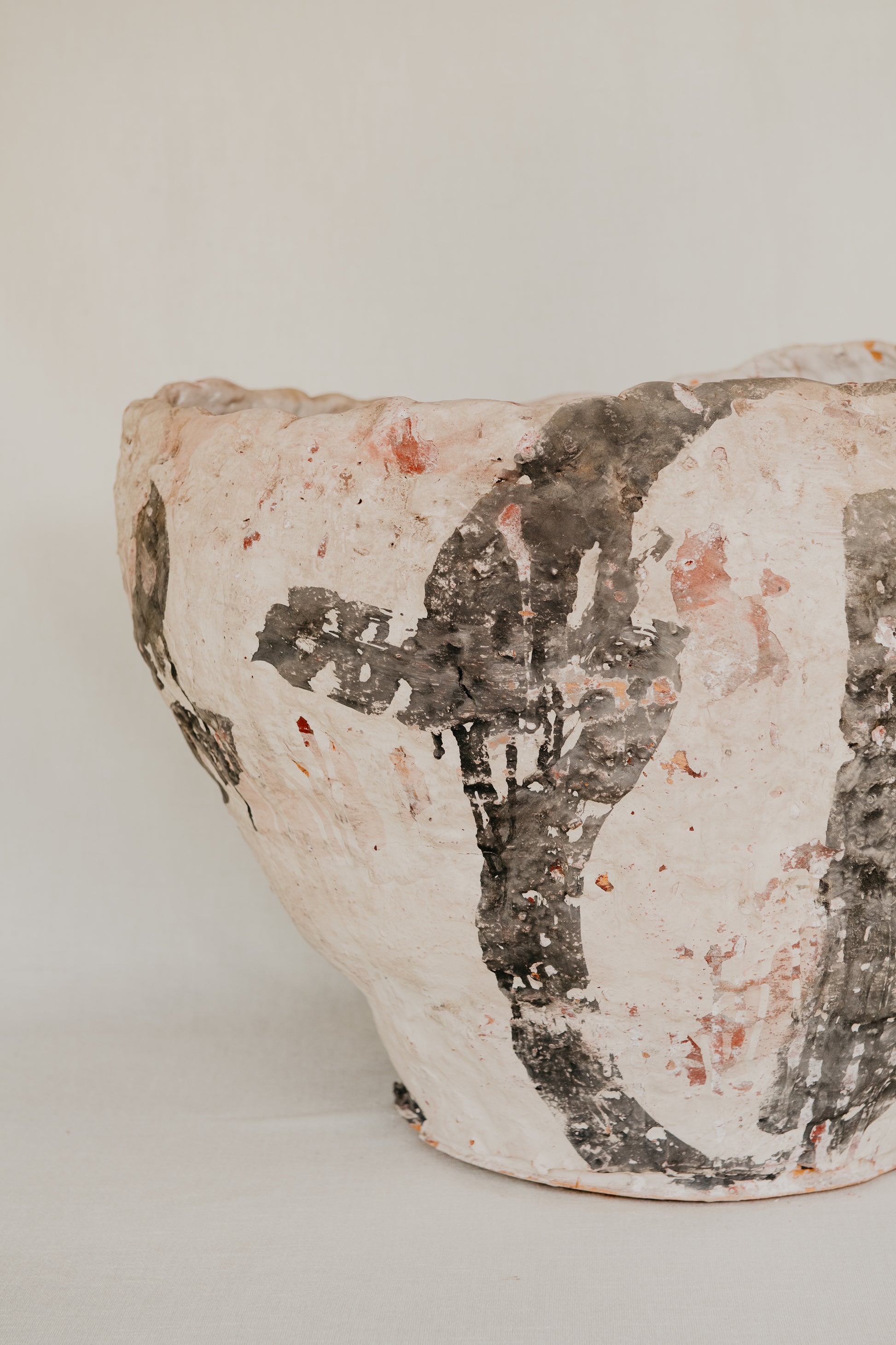 Ceramic bowl with textured surface on a plain background