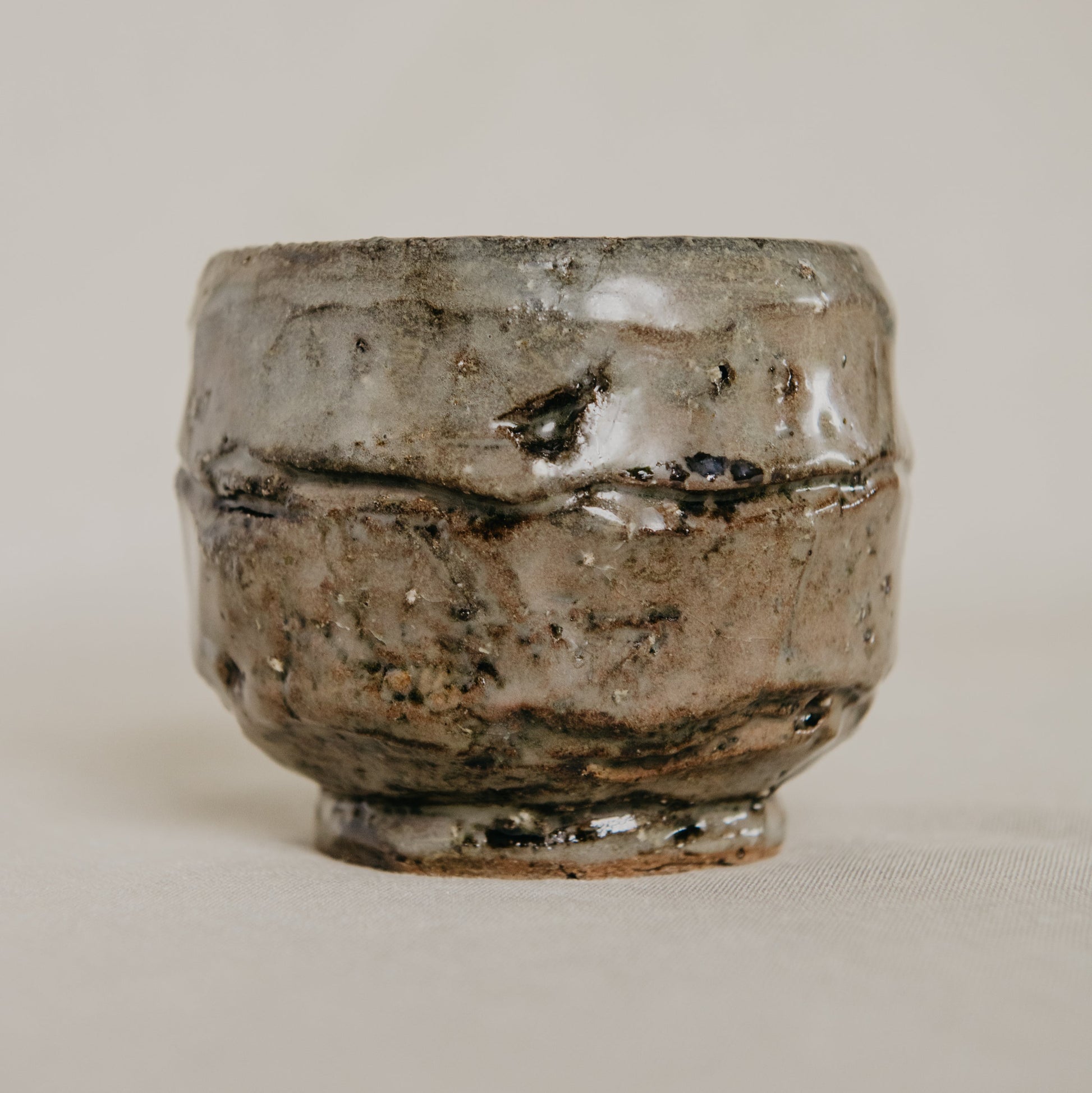 Ceramic bowl with textured surface on a plain background